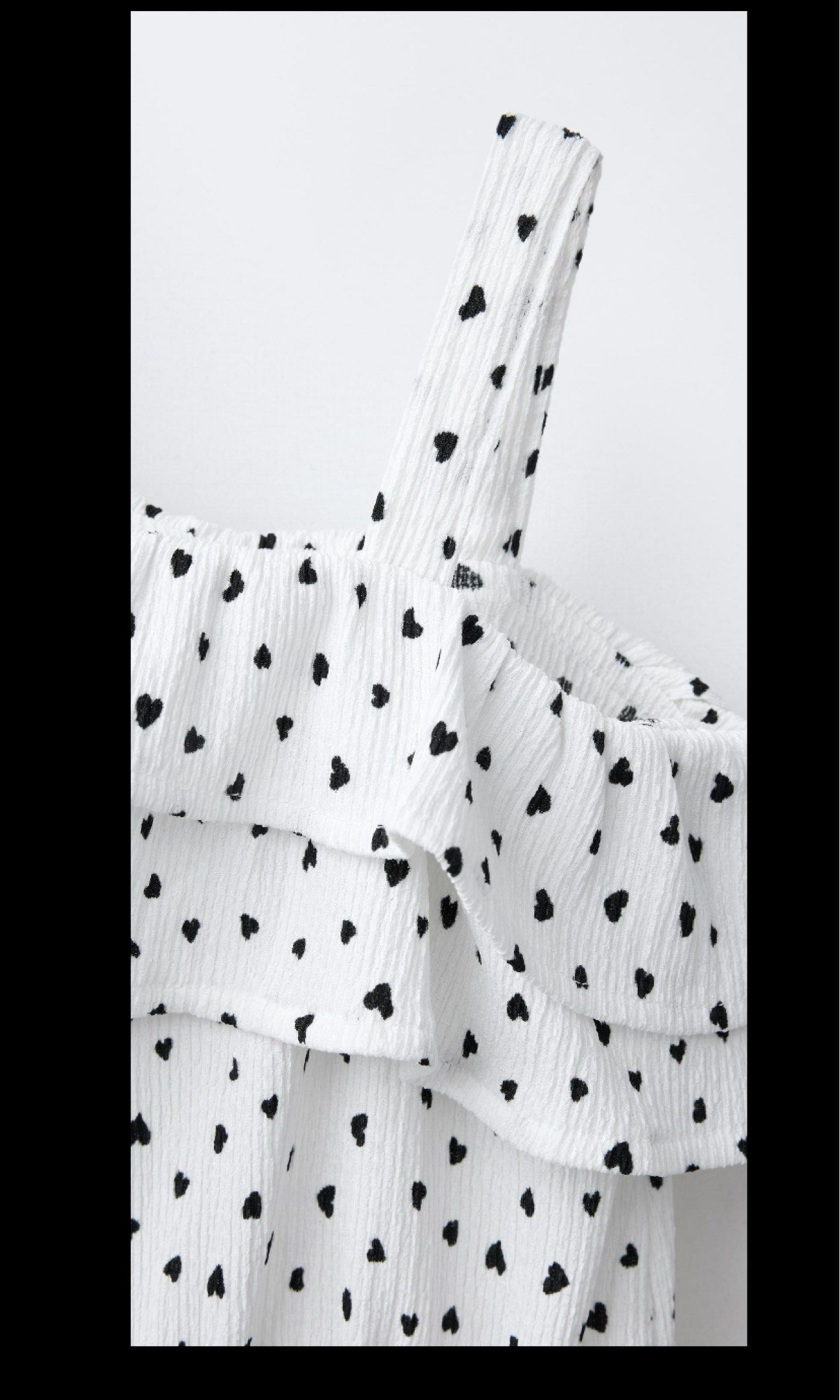 Zara Kids 164cm One Shoulder Romper (Category: Rompers) located in San Pedro. Submitted by abby2194 (Listing ID 1420880235, Image 2). Description: - Size: 13/14 years / 164cm - Adorable white romper with heart print. - Stylish one-shoulder design. - Features a ruffled neckline. - Comfortable elastic waist. - Ideal for warm weather and casual wear. - Made of textured fabric. - Playful and feminine look..