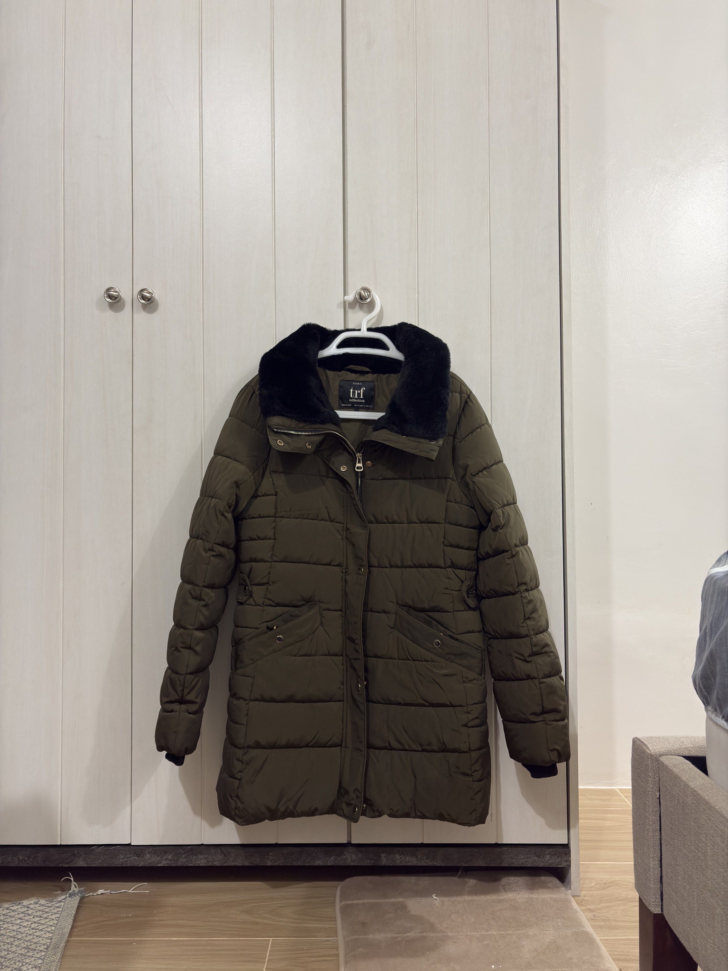 Zara puff jacket/parka for winter (Category: Coats, Jackets and Outerwear) located in Makati City. Submitted by stufflookup (Listing ID 1420803562, Image 1). Description: LAST PRICE!!! SUPER DUPER STILL! VERY NICE FOR YOUR WINTER SNOW TRIP. Used once in Japan during winter. With detachable hood. This is good as new, except there's a very tiny flaw sa zipper but it does not affect its function. Fully functional pa din ang zipper, wala problem. Siz