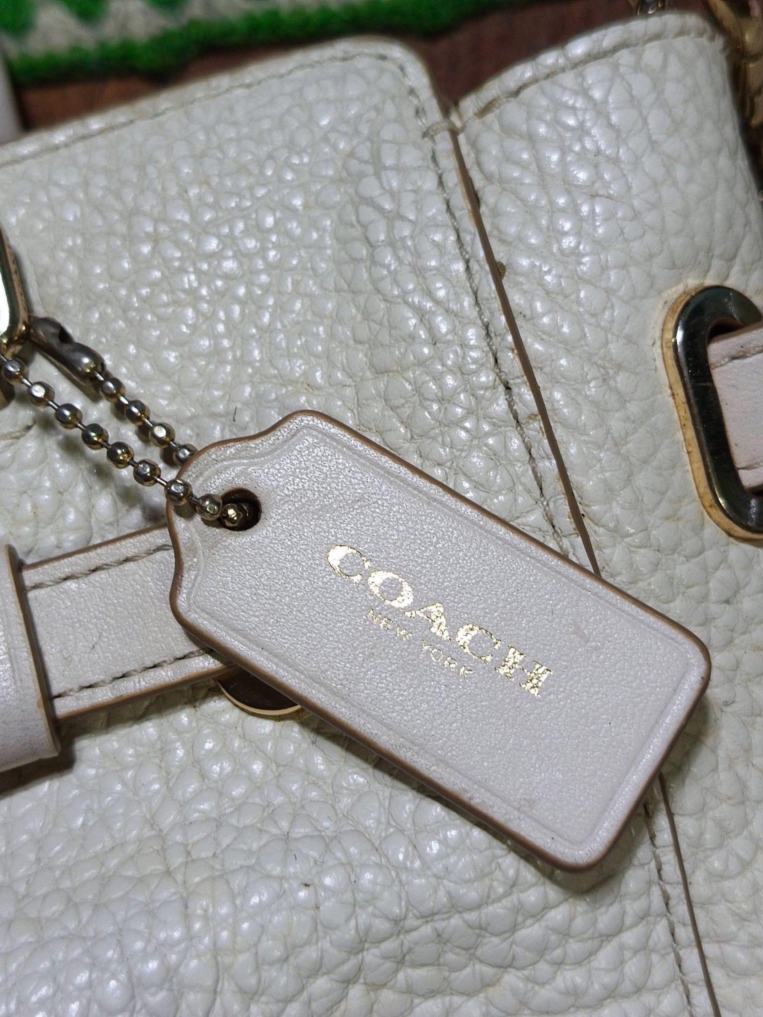 Coach Mini Blake Carryall Handbag (Category: Luxury Bags & Wallets) located in Iloilo. Submitted by preciousgems_collection (Listing ID 1421117878, Image 3). Description: - Authentic Coach Mini Blake Carryall - Cream color - Top handle and detachable shoulder strap - Includes Coach hangtag - Zip closure - Fabric-lined interior - Made in Myanmar - Gold-tone hardware - Textured leather exterior.