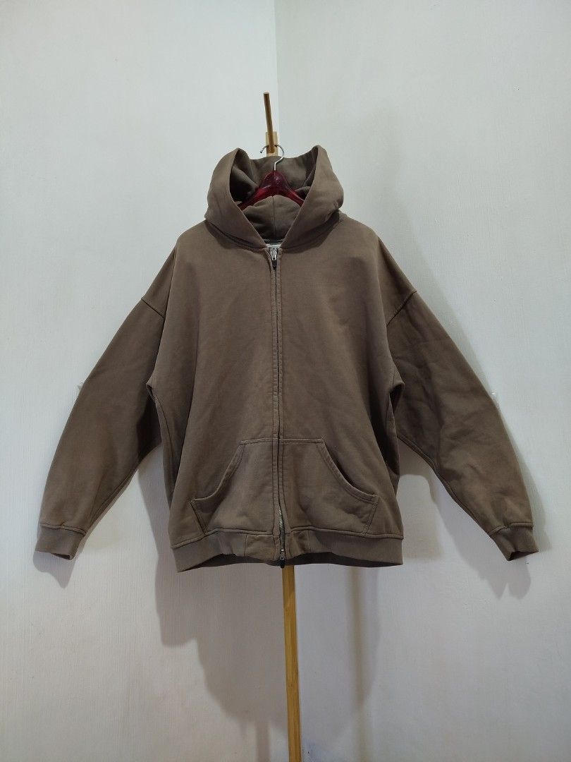 Fear of God Sixth Collection Zip Hoodie (Category: Hoodies) located in Lipa City. Submitted by france01825 (Listing ID 1421055633, Image 1). Description: - Fear of God Sixth Collection Hoodie - Color: Brown - Full zip closure - Attached hood - Two front pockets - Fear of God logo on hood - Branded zipper.