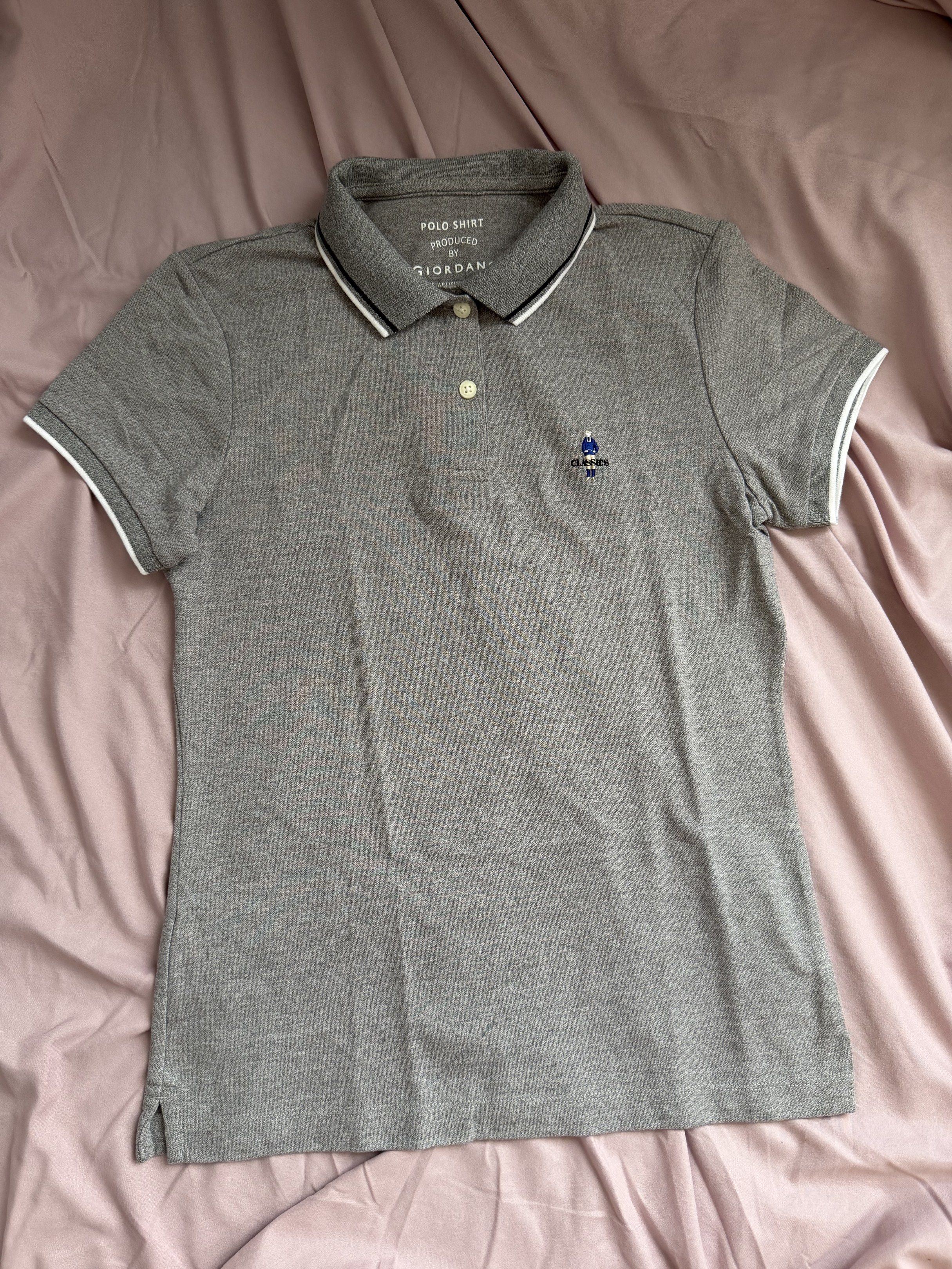 Giordano Classic Polo Shirt (Category: Shirts) located in Manila. Submitted by qfayeeeee (Listing ID 1420999512, Image 1). Description: Good as new! Worn only once. - Giordano gray polo shirt - Size: M (160/80A) for women - Classic collar with white and black trim - Short sleeves with white trim - Small embroidered logo on chest - Material: Cotton and polyester blend Size Ref: Bust - 36" laid flat Length - 24" laid flat.