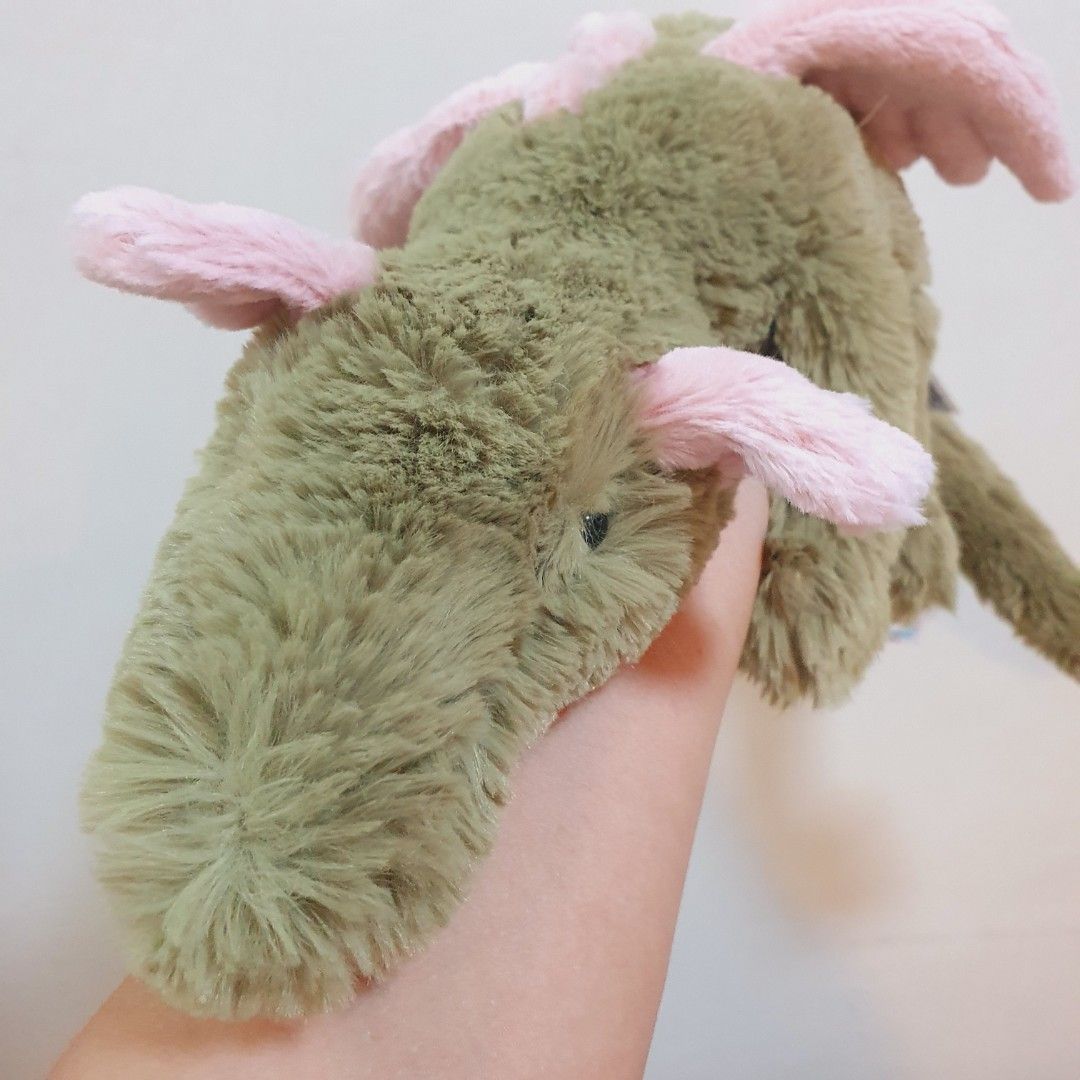 JELLYCAT Malachy Dragon (Category: Plushies & Soft Toys) located in Quezon City. Submitted by mocha_mola (Listing ID 1421047066, Image 2). Description: - Jellycat Malachy Dragon plush toy - Features a green body with pink accents - Soft, plush texture - Includes the original Jellycat London tag - Tag confirms the name: Malachy Dragon -perfect gift this Valentines Day!.
