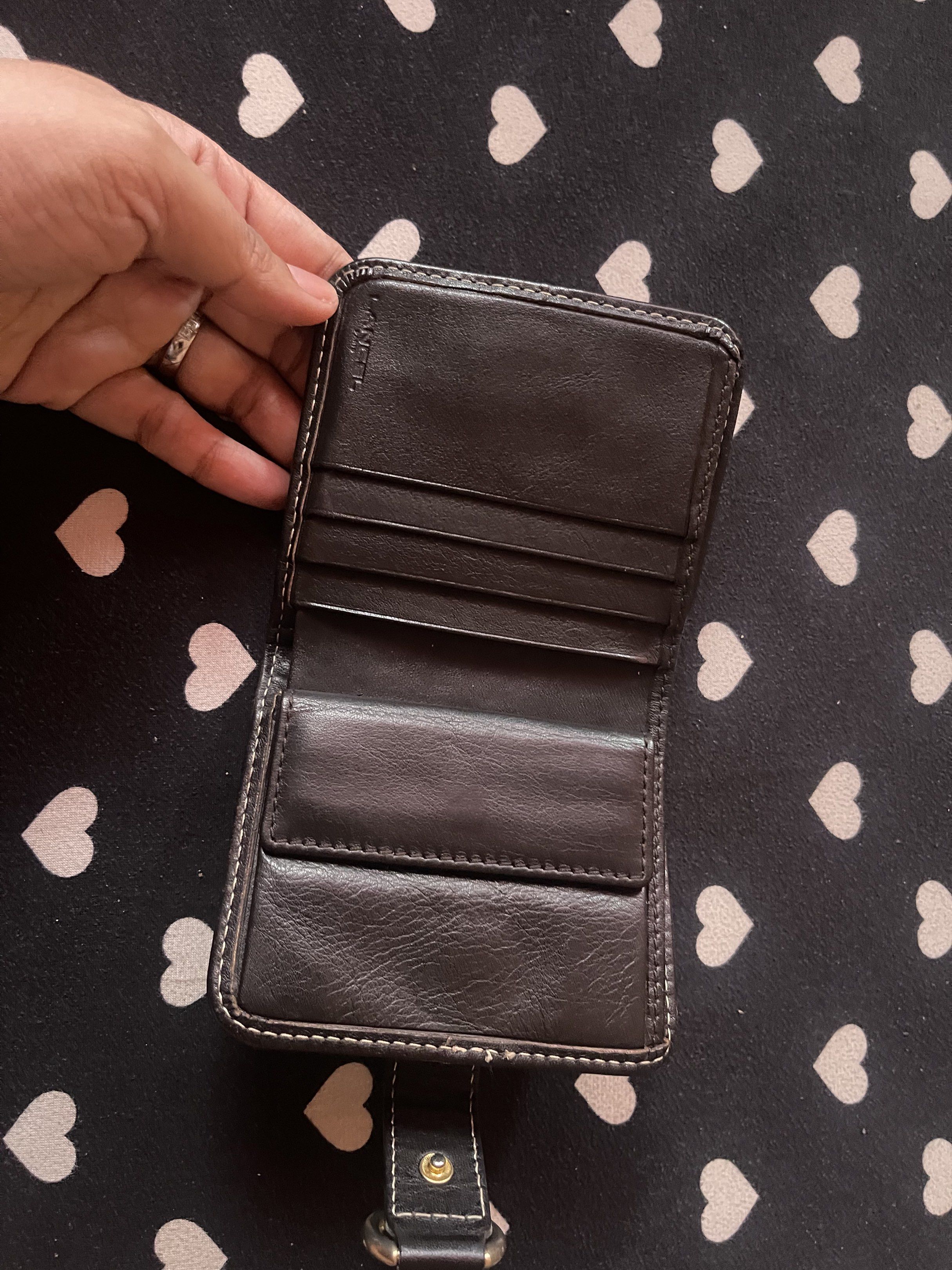 Lancel Short Wallet (Category: Luxury Bags & Wallets) located in Quezon City. Submitted by minekoh21 (Listing ID 1421016441, Image 3). Description: - Authentic Lancel Paris Luxury wallet - Genuine leather wallet - Textured exterior - Dark brown leather strap - Silver-tone ring closure with Lancel branding - Multiple card slots - Coin pocket - Bill compartment - White stitching - Patterned lining RFS: Decluttering.