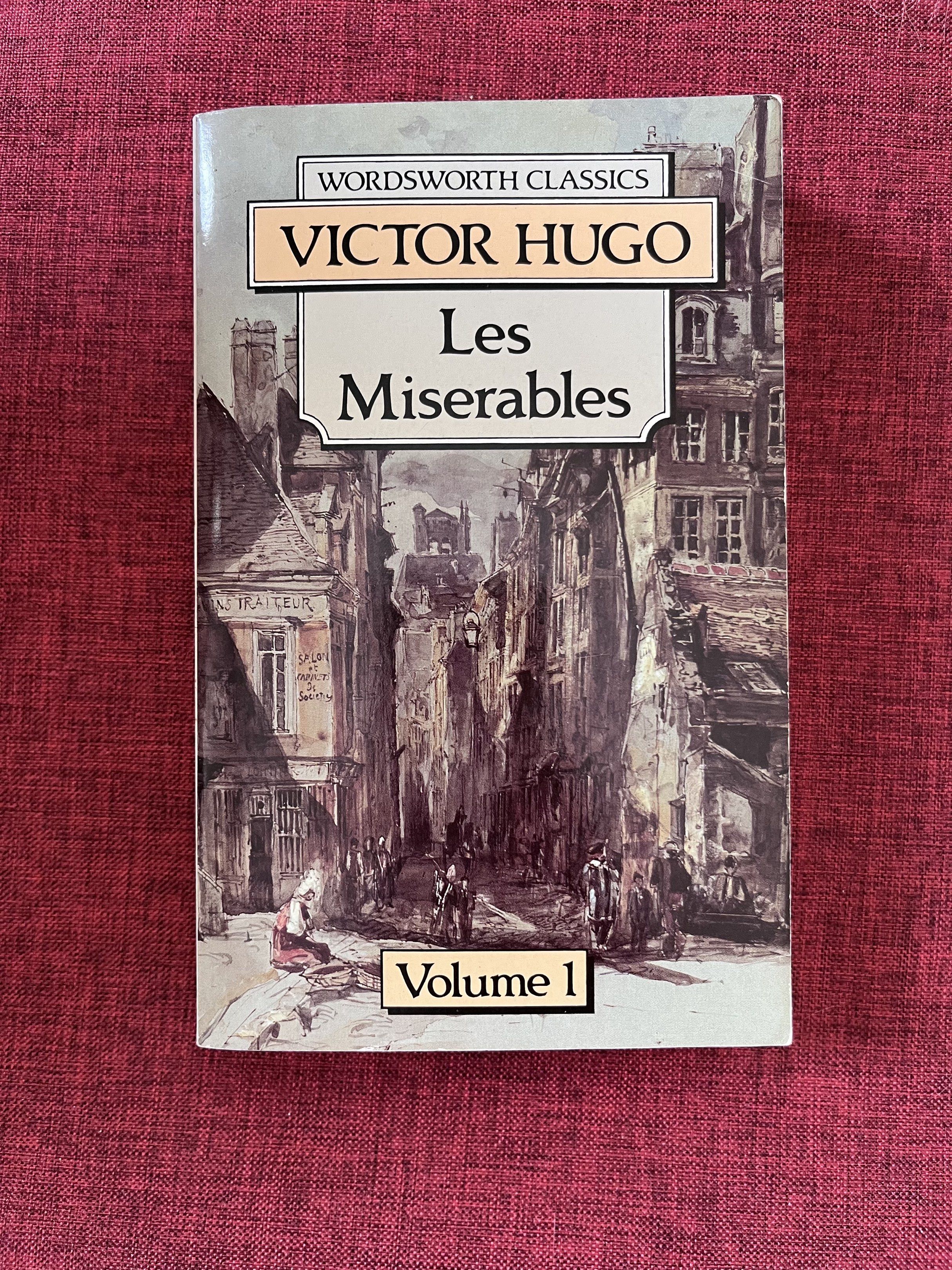 Les Miserables Volume 1 by Victor Hugo (Category: Storybooks) located in Maragondon. Submitted by quilljoylibrary (Listing ID 1421019335, Image 1). Description: - Les Miserables Volume 1 by Victor Hugo - Published by Wordsworth Classics - Features a street scene cover illustration - Title and author visible on spine.