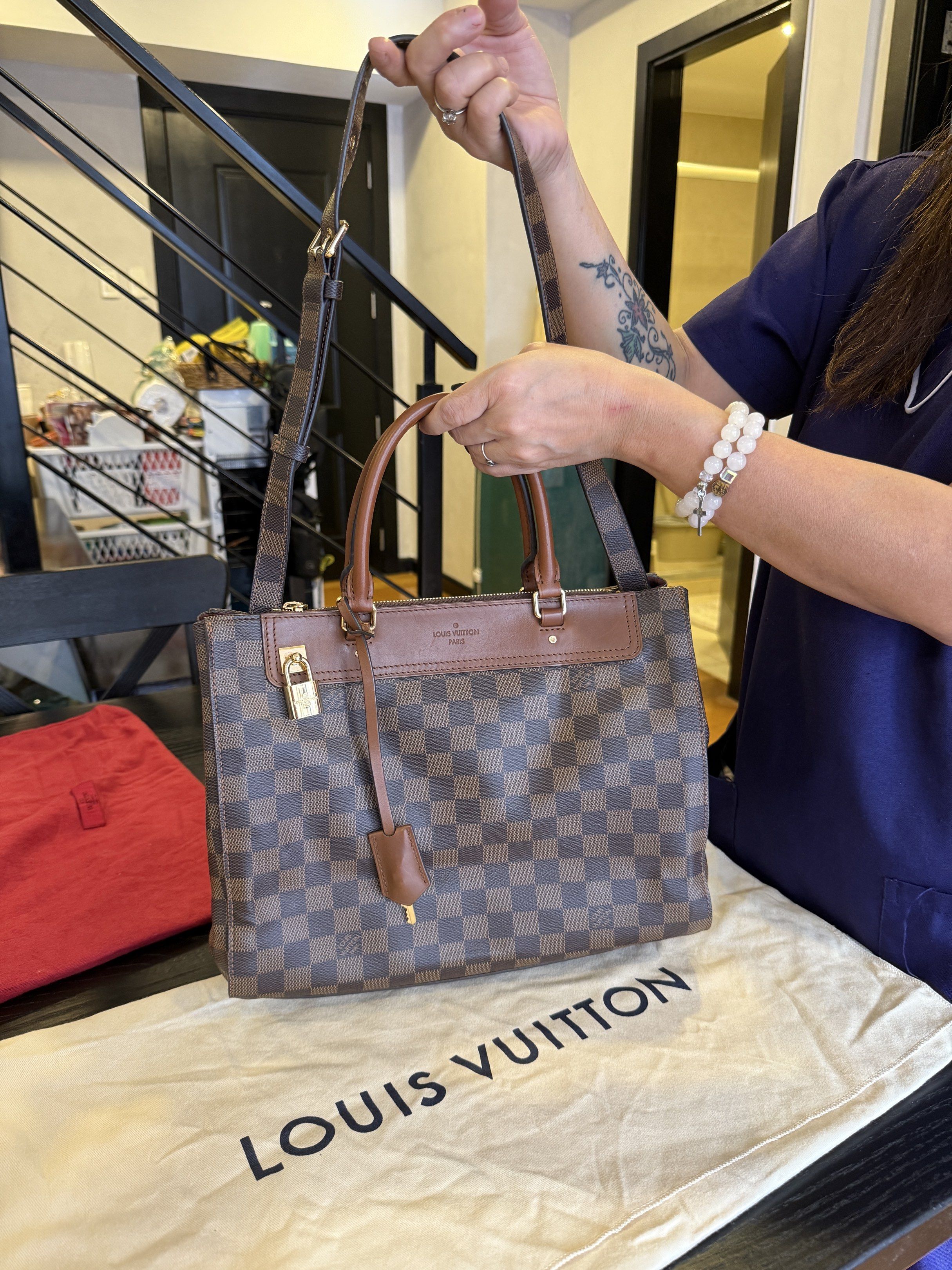 Louis VuittonHandbag (Category: Luxury Bags & Wallets) located in Makati City. Submitted by camposbelle_shark (Listing ID 1421111958, Image 2). Description: - Authentic Louis Vuitton Trevi PM handbag - Brown leather trim and handles - Gold-tone hardware - Top zip closure - Detachable shoulder strap - Includes Louis Vuitton charm - Comes with dust bag - Classic checkered pattern - Structured shape.