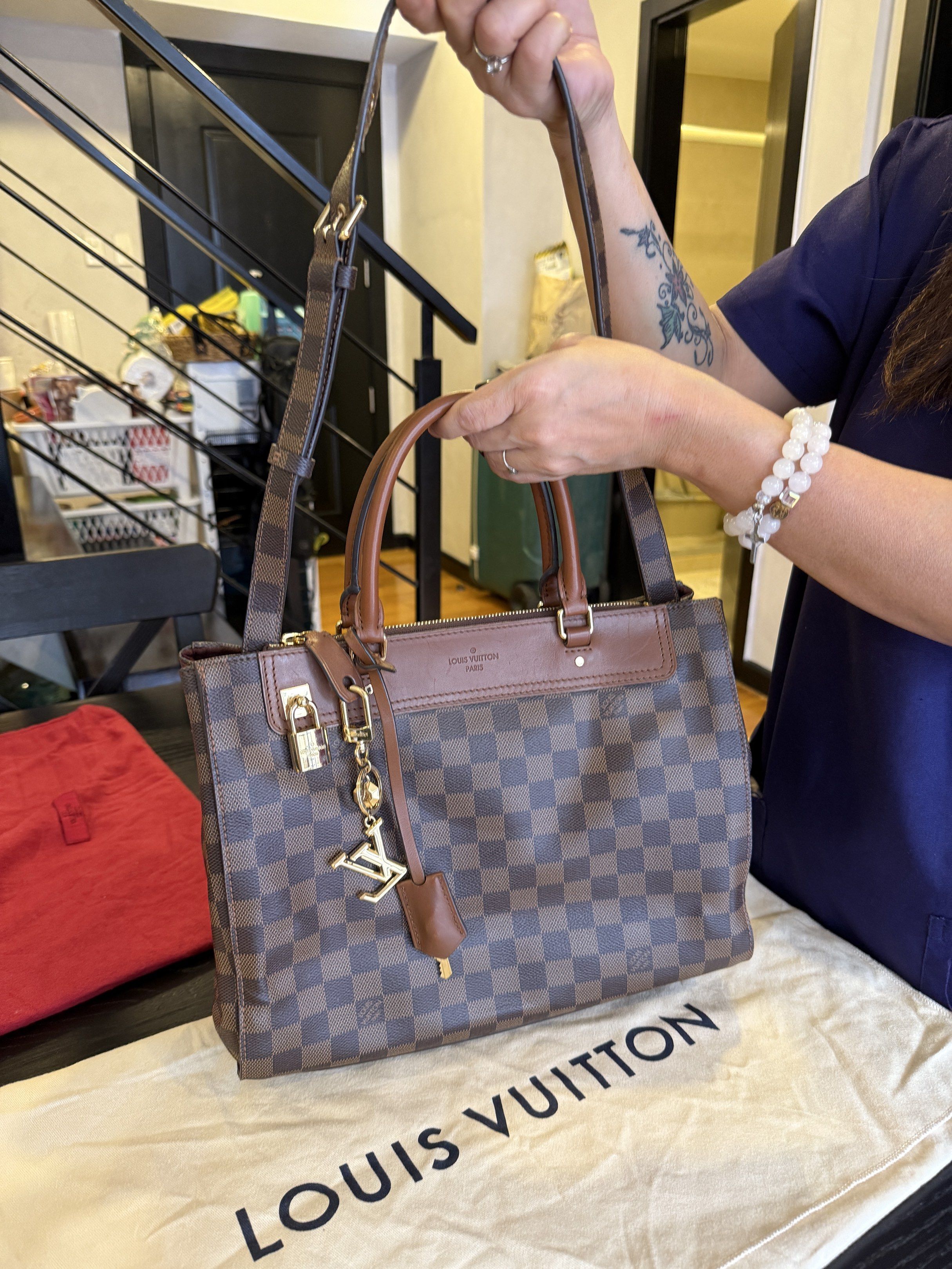 Louis VuittonHandbag (Category: Luxury Bags & Wallets) located in Makati City. Submitted by camposbelle_shark (Listing ID 1421111958, Image 1). Description: - Authentic Louis Vuitton Trevi PM handbag - Brown leather trim and handles - Gold-tone hardware - Top zip closure - Detachable shoulder strap - Includes Louis Vuitton charm - Comes with dust bag - Classic checkered pattern - Structured shape.
