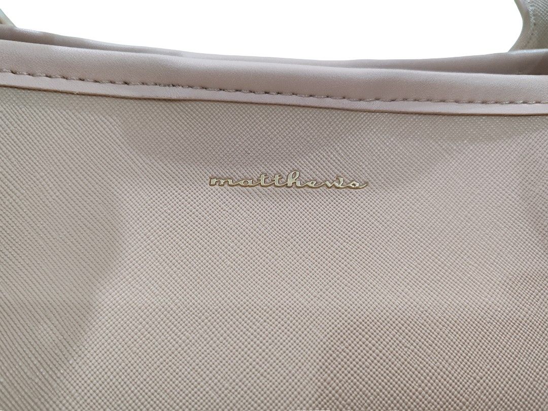 Matthews Bag (Category: Tote Bags) located in Paranaque City. Submitted by winter_pinecone (Listing ID 1421003703, Image 3). Description: - never been used bag from matthews - best for casual use - comes with detachable mini-pouch - just the right size, not too small, not too big - comes with matthews black cloth wrap - originally bought in sm makati for 999.
