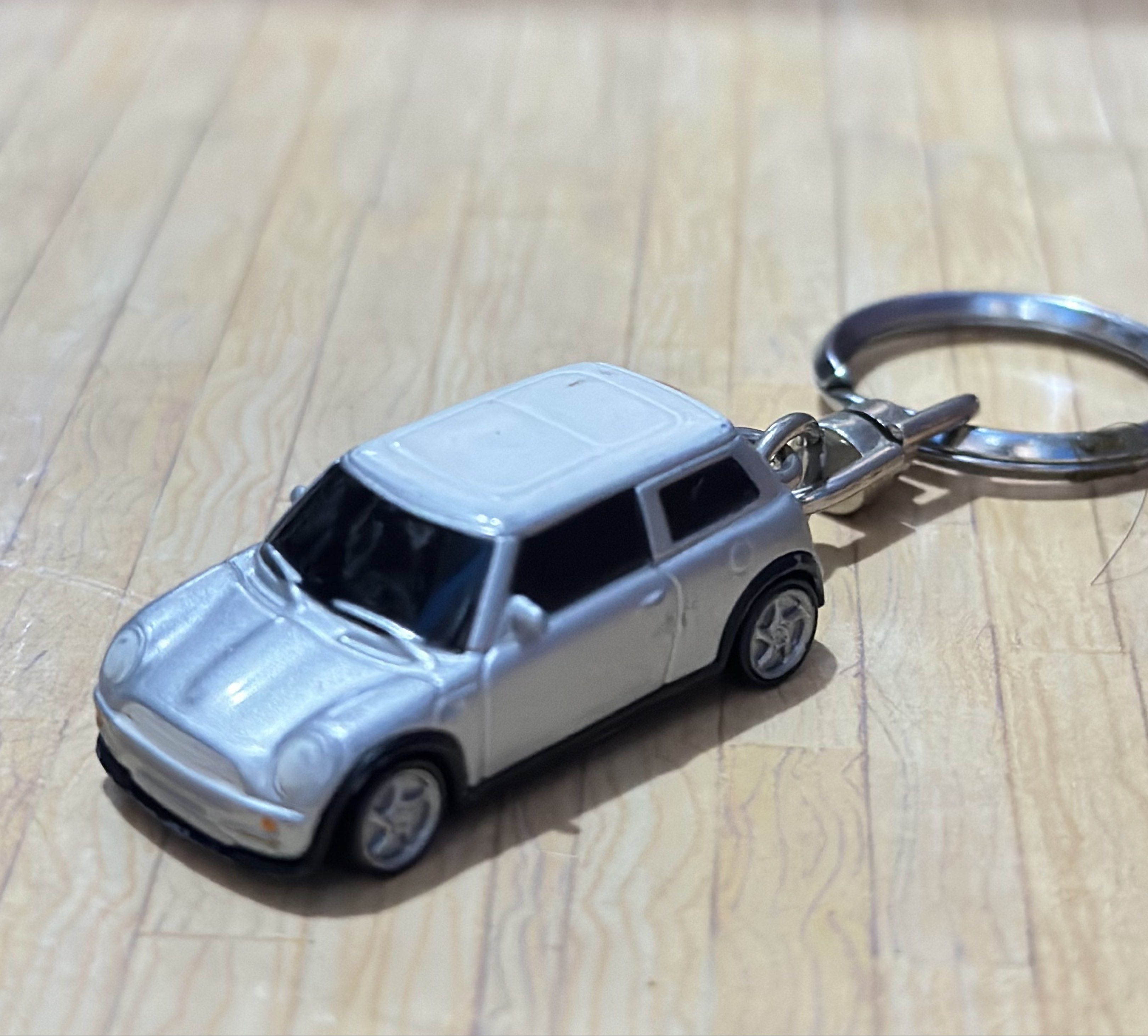 Mini Cooper Diecast Keychain White and Silver Metallic (Category: Vehicle & Diecast Models) located in General Santos City (Dadiangas). Submitted by toysville888 (Listing ID 1421034882, Image 1). Description: - Mini Cooper keychain - Miniature silver car model with a white roof - Made of metal - Underside marked "NO. 98839" and "MADE IN CHINA" - Attached to a keyring.