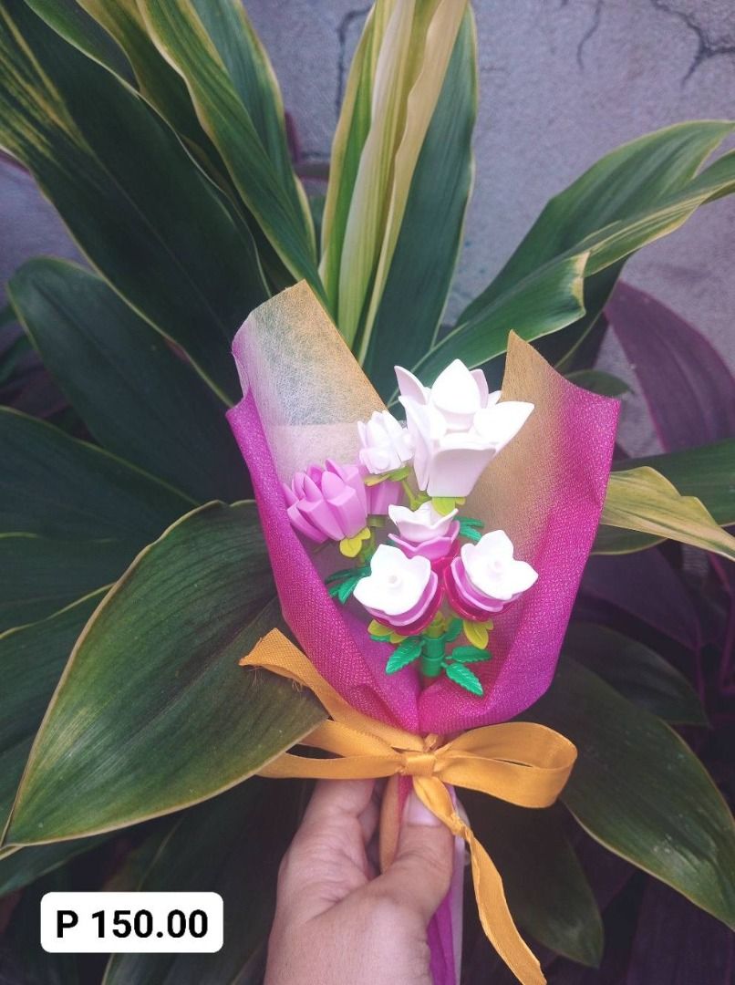 Miniature Lego Flowers Bouquet (Category: Flowers & Bouquets) located in Manila. Submitted by smnthdb97 (Listing ID 1417115669, Image 2). Description: FOR SALE! Miniature Lego Flowers Bouquet Perfect for Valentine's Day Price List: - P 50.00 EACH - P 150.00 EACH - P 180.00 EACH - P 500.00 (1 pc only) - Adorable miniature flower bouquets - Perfect as gifts or decorations - Features colorful flowers - Wrapped in decorative paper - Tied with a yello