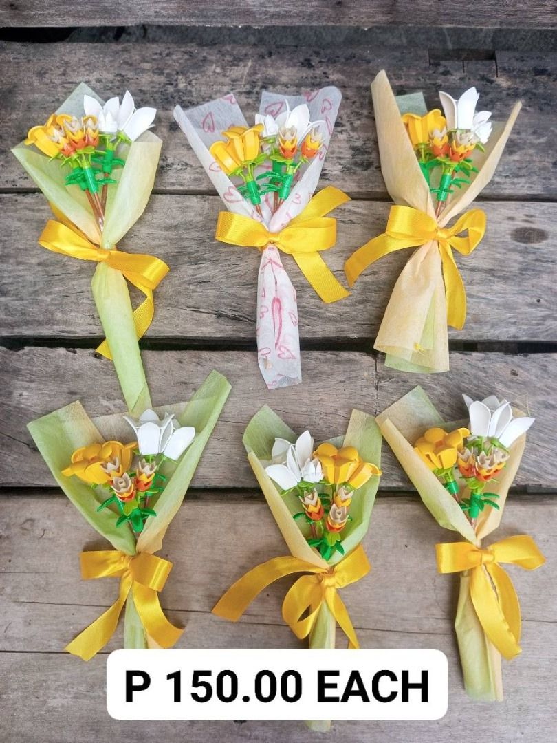Miniature Lego Flowers Bouquet (Category: Flowers & Bouquets) located in Manila. Submitted by smnthdb97 (Listing ID 1417115669, Image 3). Description: FOR SALE! Miniature Lego Flowers Bouquet Perfect for Valentine's Day Price List: - P 50.00 EACH - P 150.00 EACH - P 180.00 EACH - P 500.00 (1 pc only) - Adorable miniature flower bouquets - Perfect as gifts or decorations - Features colorful flowers - Wrapped in decorative paper - Tied with a yello