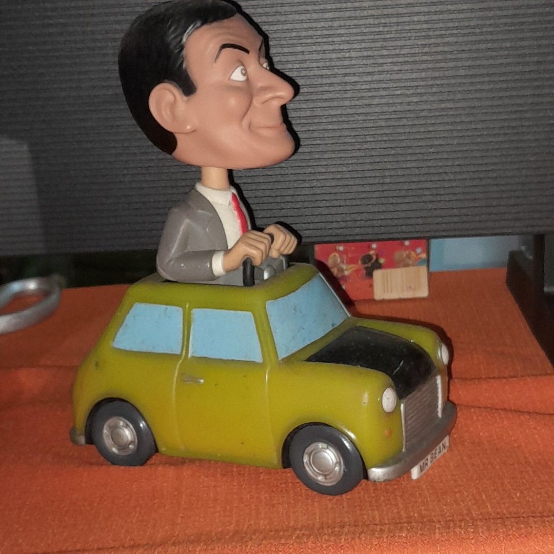 Mr. Bean Car Figurine (Category: Vehicle & Diecast Models) located in Baguio. Submitted by shellcollector (Listing ID 1420969220, Image 2). Description: - Mr. Bean figurine. - Features Mr. Bean in his iconic car. - Color: Yellow and Blue. - Car license plate reads "MR BEAN". - Base markings: "Aspect Productions Ltd 2007" and "Funko LLC 2007 2500 Pesos Baguio shipping.