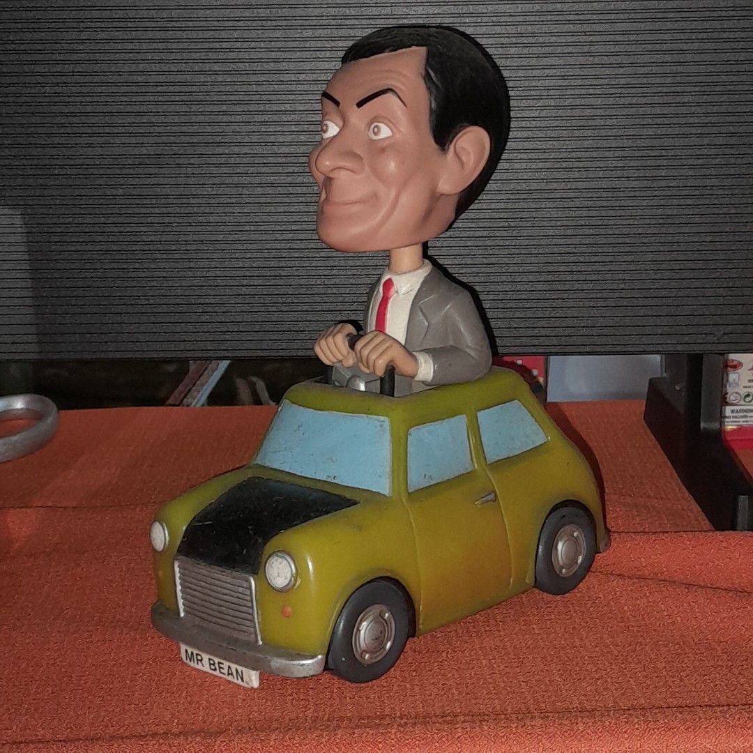 Mr. Bean Car Figurine (Category: Vehicle & Diecast Models) located in Baguio. Submitted by shellcollector (Listing ID 1420969220, Image 1). Description: - Mr. Bean figurine. - Features Mr. Bean in his iconic car. - Color: Yellow and Blue. - Car license plate reads "MR BEAN". - Base markings: "Aspect Productions Ltd 2007" and "Funko LLC 2007 2500 Pesos Baguio shipping.