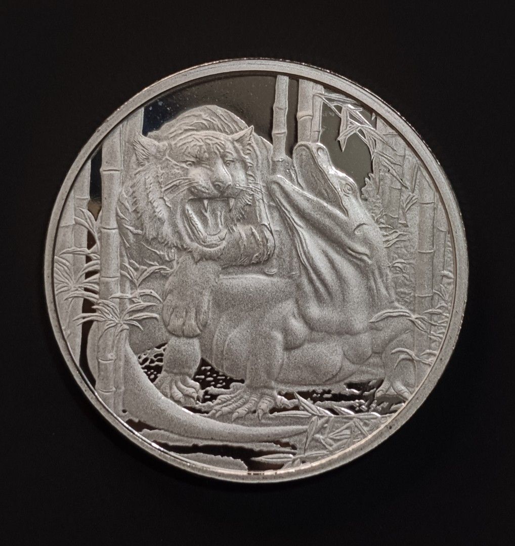 Niue 2022 One Dollar Fine Silver Coin (Category: Currency) located in Paranaque City. Submitted by phcoincollective (Listing ID 1421085840, Image 1). Description: - 2022 Niue One Dollar coin - Features a detailed Tiger and Komodo dragon design - Reverse side: Queen Elizabeth II - Inscription: "ONE DOLLAR" and "1 OZ 999 SILVER" - Made of 1 oz 999 silver.