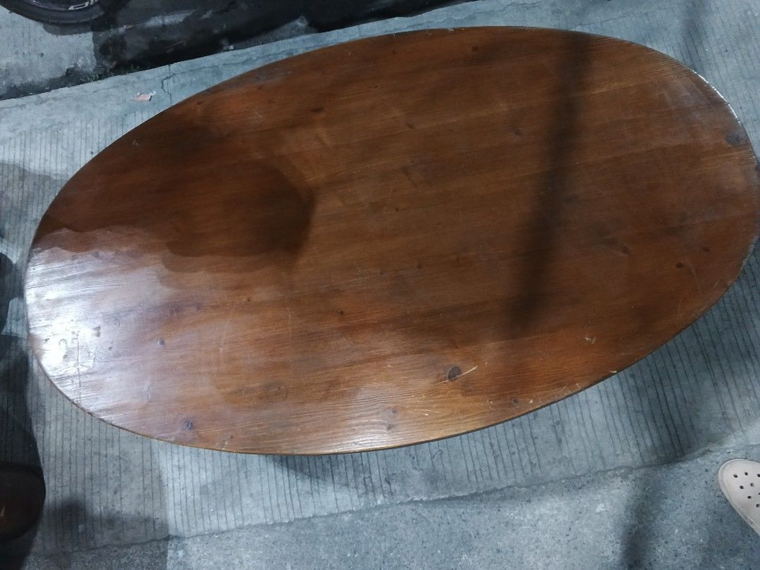 Oval Fdable Wooden Coffee Table (Category: Tables & Sets) located in Caloocan City. Submitted by surplusandbnewshop (Listing ID 1421114259, Image 3). Description: - Oval coffee table - Warm brown finish - Visible wood grain - Three curved legs - Smooth surface with minor wear - Suitable for living rooms and lounges.