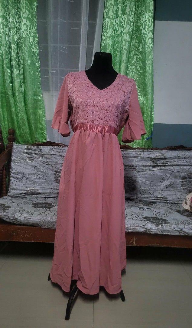 Pink Formal Dresses (Category: Dresses) located in Pasig City. Submitted by siyerli8 (Listing ID 1420969155, Image 3). Description: - Elegant pink formal dresses - V-neckline with lace detailing - Flowing skirt - Flattering silhouette - Available styles: short sleeves, wrap-style front - Ideal for formal events and evening wear.