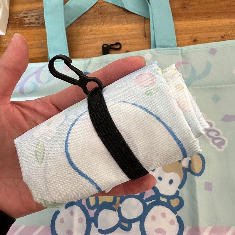 Pochacco / Cinnamoroll Foldable Tote Bag (Category: Tote Bags) located in Manila. Submitted by peoniesandviolets (Listing ID 1421054135, Image 2). Description: Foldable Eco-friendly Bag Shopping Bag Large Capacity Lightweight 42x25x10.5cm Available designs Pochacco Cinnamoroll.