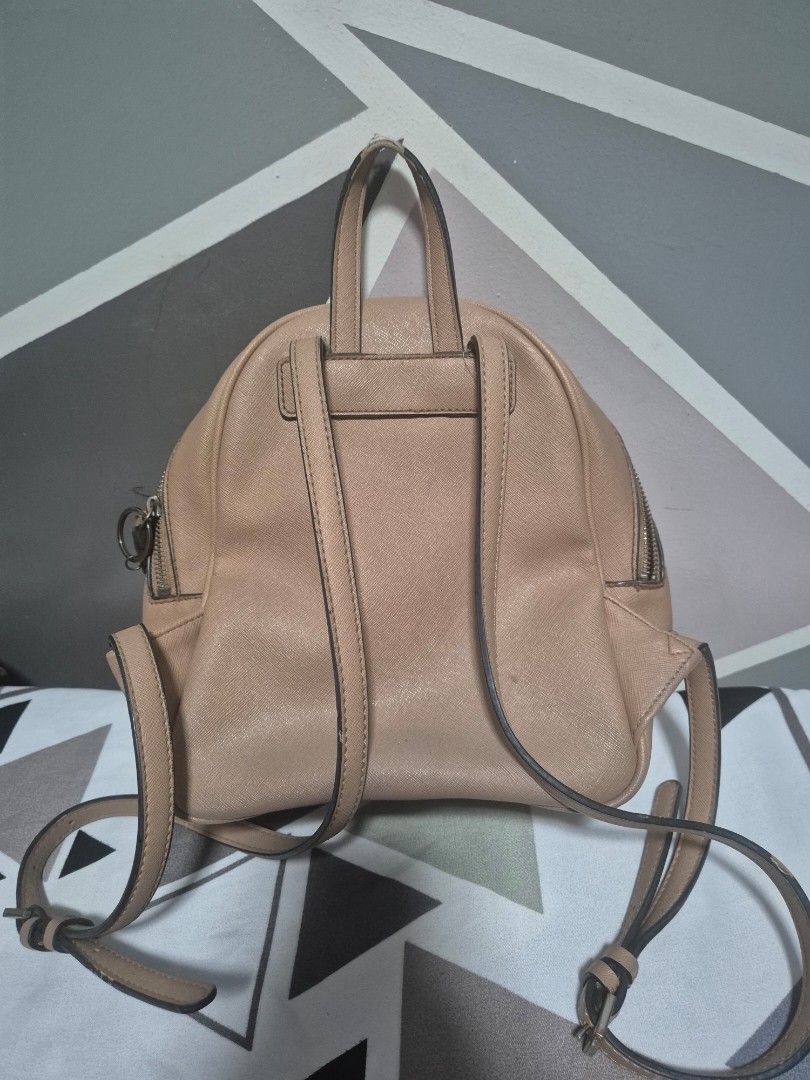 Preloved Guess Bag (Category: Backpacks) located in Manila. Submitted by wendilynma54284 (Listing ID 1421063533, Image 2). Description: - Preloved Original Guess bag - Backpack style - Neutral color - Features the Guess logo - Interior lining with Guess pattern - No issues, Signs of usage only - RFS: Marami ng new bags and need funds - Location Taytay? Rizal.