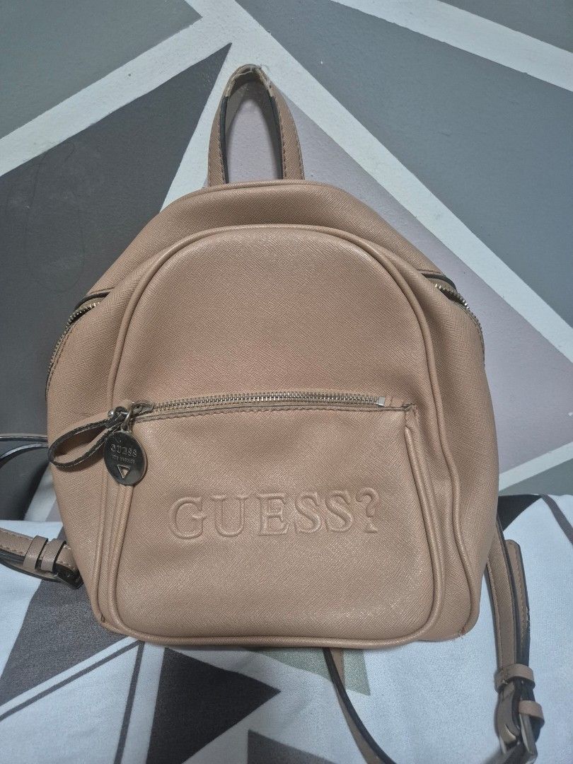 Preloved Guess Bag (Category: Backpacks) located in Manila. Submitted by wendilynma54284 (Listing ID 1421063533, Image 1). Description: - Preloved Original Guess bag - Backpack style - Neutral color - Features the Guess logo - Interior lining with Guess pattern - No issues, Signs of usage only - RFS: Marami ng new bags and need funds - Location Taytay? Rizal.