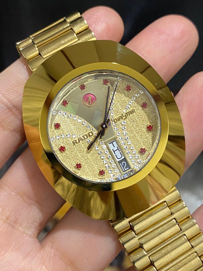 Rado Diastar Original (Category: Luxury Watches) located in Bulacan. Submitted by youlovewatches (Listing ID 1421109113, Image 1). Description: Rado Diastar (Original) Details: Red Crystal Digits Gold Dial, Rare Automatic Movement 35.5mm Case Diameter 6'0 Date Calendar Deployant Clasp Strap 9/10 Mint - Very Good Condition Guaranteed Authentic Set with: "Presentation box" Mall Price: 80,000-95,000 php Our Price: 38,000 Php Money Back Guaranteed if
