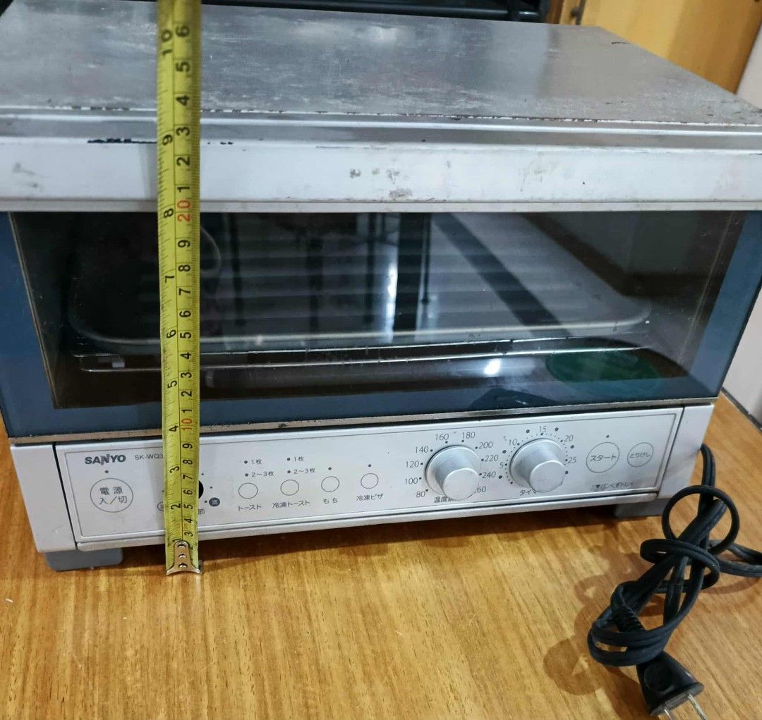 Sanyo Toaster Oven (Category: Ovens & Toasters) located in Cainta. Submitted by up_for_second_chance (Listing ID 1420951181, Image 2). Description: - Sanyo toaster oven - Multiple settings available - Glass door - Temperature and timer control knobs - Includes a tray - Silver and blue exterior - Control panel with Japanese characters - Attached power cord - 100V needs.