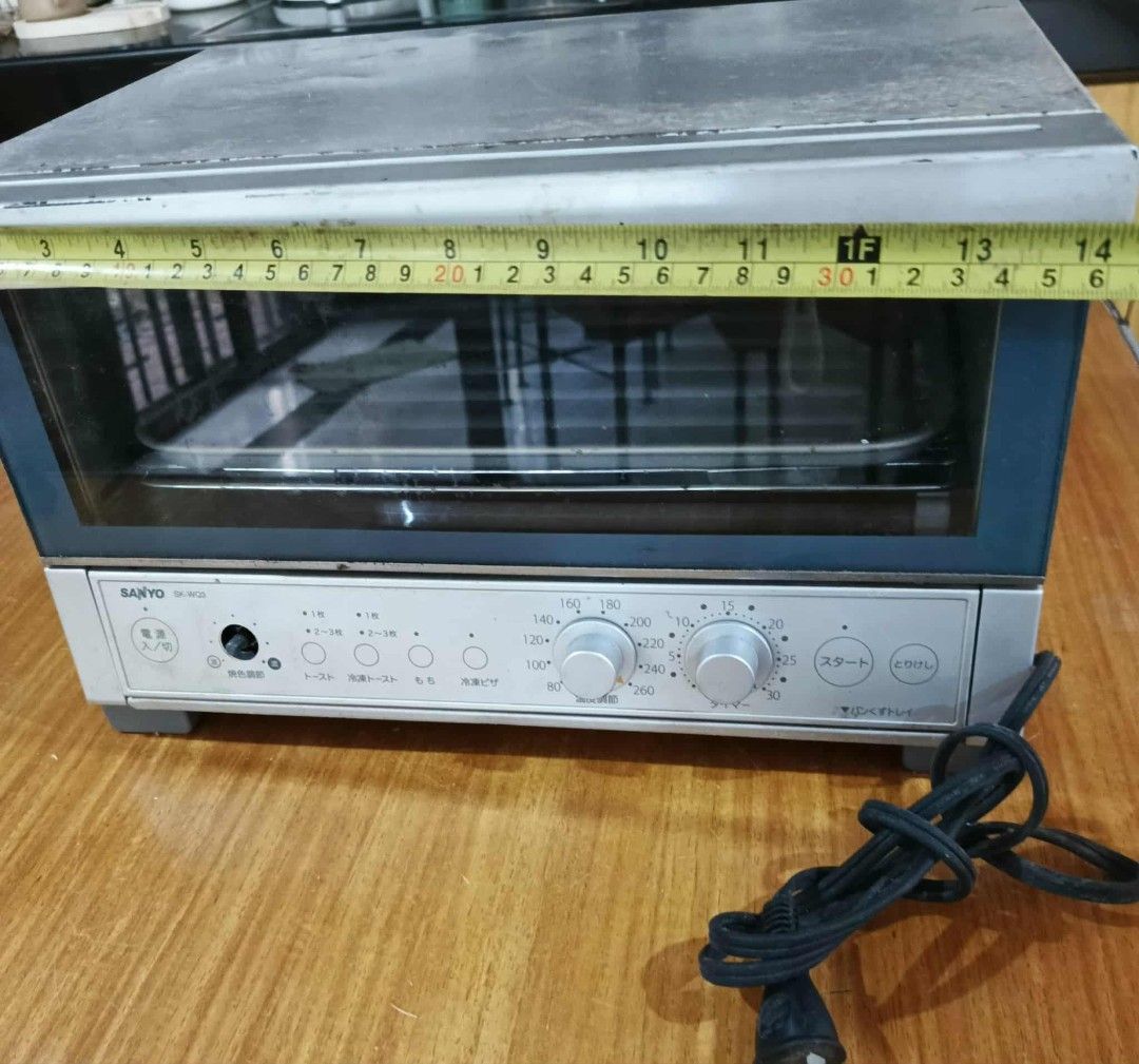 Sanyo Toaster Oven (Category: Ovens & Toasters) located in Cainta. Submitted by up_for_second_chance (Listing ID 1420951181, Image 1). Description: - Sanyo toaster oven - Multiple settings available - Glass door - Temperature and timer control knobs - Includes a tray - Silver and blue exterior - Control panel with Japanese characters - Attached power cord - 100V needs.
