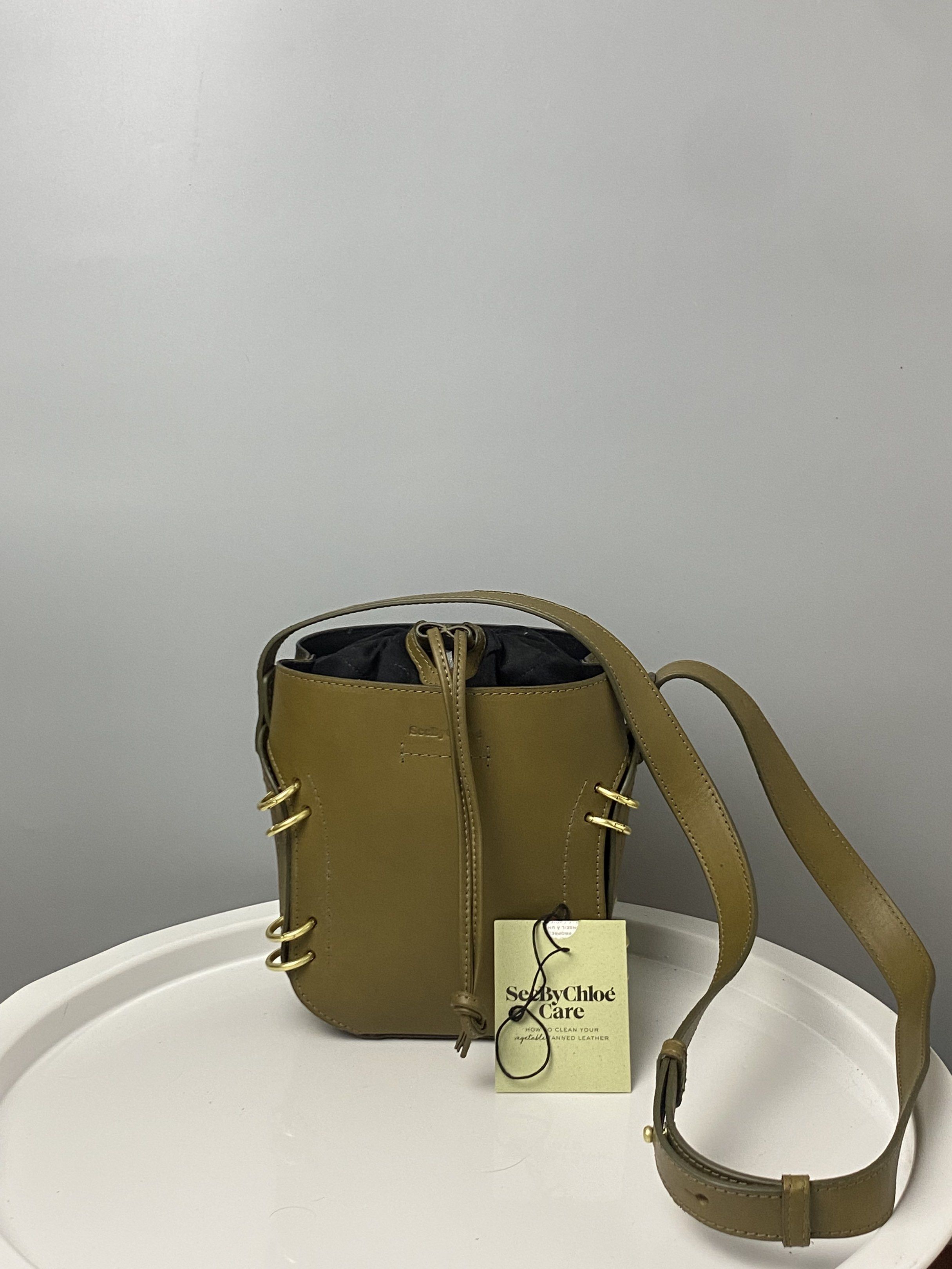See by Chloé Bucket Bag (Category: Luxury Bags & Wallets) located in Tacloban City. Submitted by luxefind12345 (Listing ID 1420962191, Image 1). Description: - See by Chloé bucket bag - Drawstring closure - Detachable shoulder strap - Gold-tone hardware - Unique design - Black fabric lining with small pocket - Made in India - Comes with original tag.