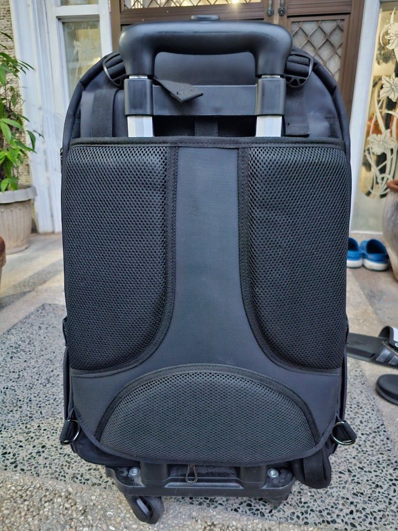 SENA Rolling Backpack (Category: Backpacks) located in Manila. Submitted by anjelincloset (Listing ID 1420975373, Image 2). Description: Durable SENA rolling backpack - Black exterior - Multiple compartments with zippered closures - Top handle for carrying - Retractable handle for rolling - Padded mesh back for comfort - 4 rolling wheels - Ideal for travel or work essentials Bought for 3k+ Used for 2x only Like new.