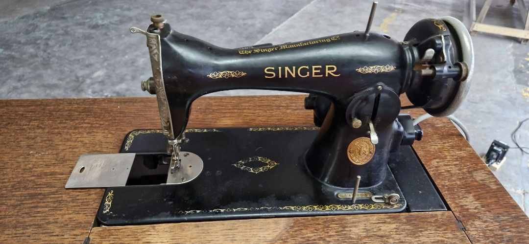 Singer Sewing Machine with Table and Chair (Category: Other Home Appliances) located in Marikina City. Submitted by boysel (Listing ID 1421059991, Image 1). Description: - Vintage Singer 15K sewing machine - Manufactured in 1936 - Motorized - Includes wooden table with drawer, made from oak - Comes with chair - Original accessories included: box, power cord, manuals - Serial number: EA492832 - Good working condition - Produced in Scotland, UK - C