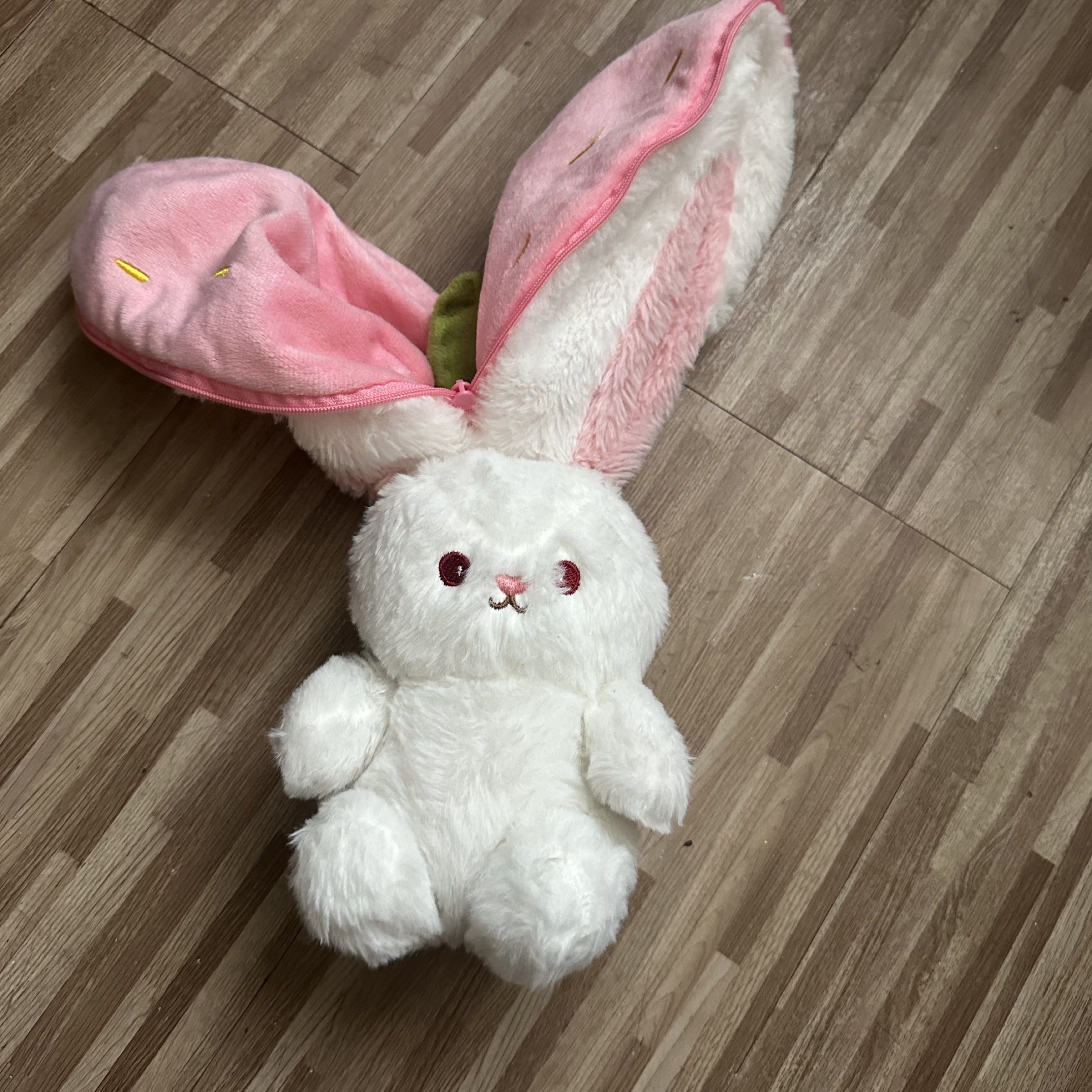 Strawberry Bunny Plush Toy (Category: Plushies & Soft Toys) located in Marilao. Submitted by extra_stuff (Listing ID 1420993248, Image 2). Description: - Adorable white bunny plush toy. - Features red eyes and a small embroidered face. - Includes a pink, strawberry-shaped cover. - Strawberry cover has green leaves and yellow embroidered seeds. - Bunny's ears are extendable..