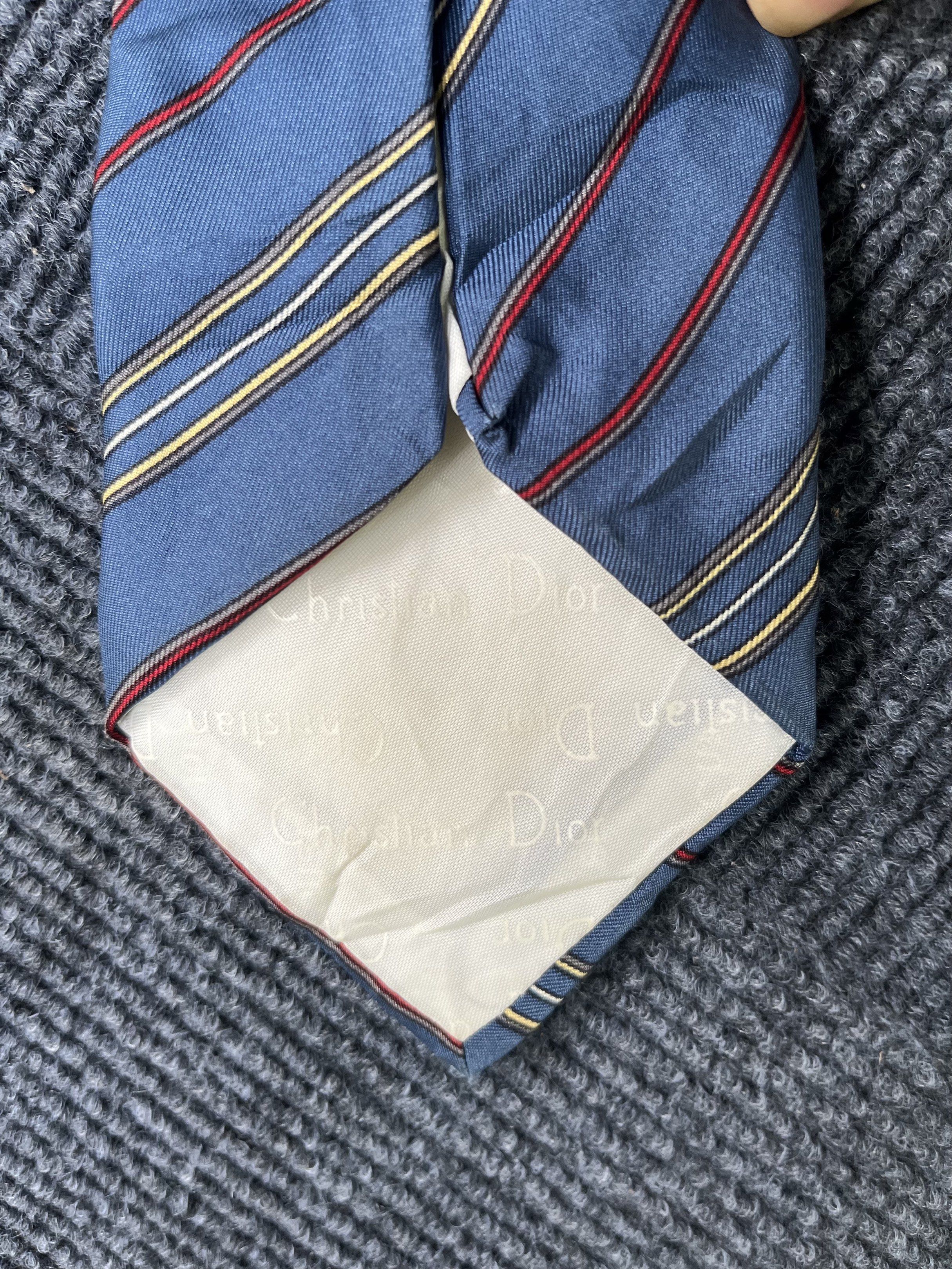 Vintage Christian Dior Silk Tie (Category: Ties) located in Batangas. Submitted by ciicalla (Listing ID 1421019520, Image 3). Description: - Christian Dior tie - Need wash - Blue base with red and yellow stripes - 100% silk - Made in Paris and New York - Features Christian Dior logo on the lining - Perfect for formal events.