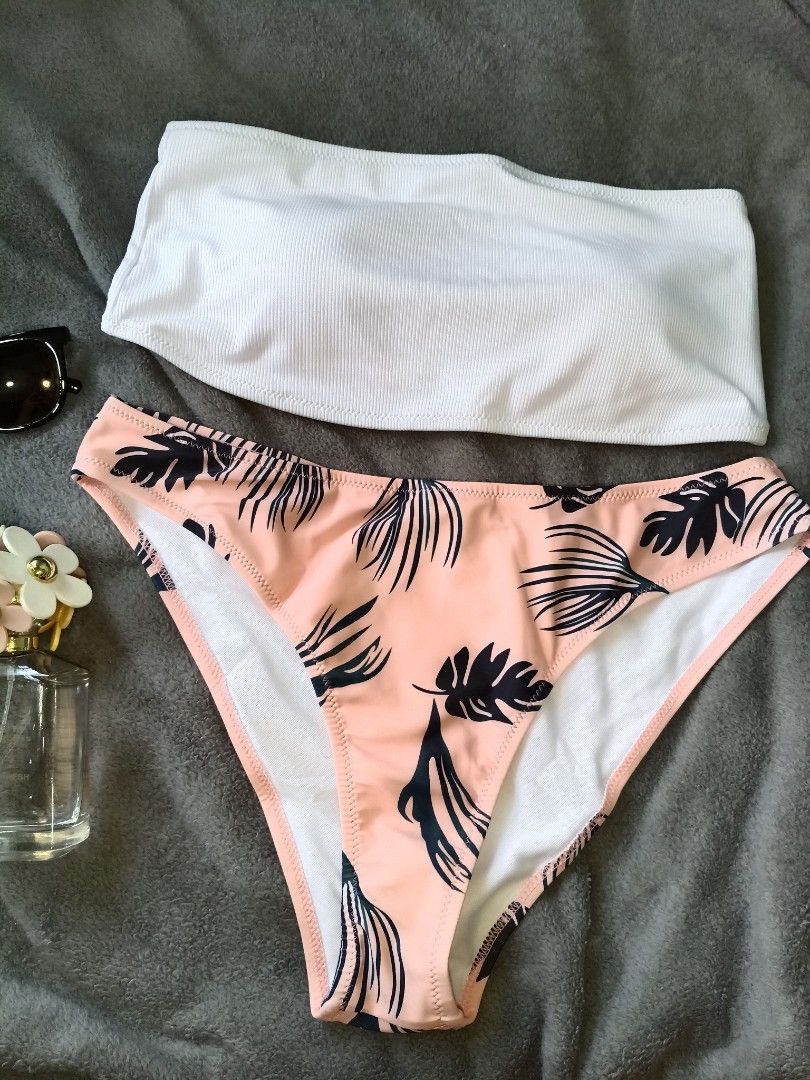 White tube Bikini style Swimsuit (Category: Bikinis & Swimsuits) located in Pasig City. Submitted by clarkpomelo (Listing ID 1421033953, Image 2). Description: - Shein White Tube Bikini - Size: XL - Features a white tube top - Bottoms: Peach with leaf design.