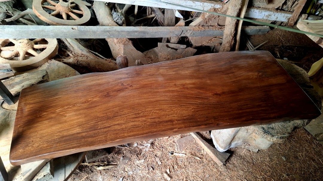 Wooden Slab Table (Category: Tables & Sets) located in Quezon City. Submitted by sebastianjay22 (Listing ID 1420992780, Image 1). Description: - Solid wooden slab table - Features a rich, natural wood grain - Smooth, polished surface - Unique, organic shape with live edges - Ideal for rustic or farmhouse style - A great addition to any home.