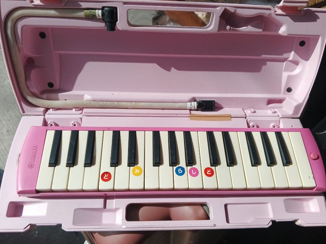 Yamaha Melodica (Category: Musical Instruments) located in Caloocan City. Submitted by surplusandbnewshop (Listing ID 1420981455, Image 2). Description: - Yamaha melodica with case - Available colors: Green and Pink - Includes: Mouthpiece and flexible tube - Key labels: Japanese characters - Green melodica has stickers on keys.