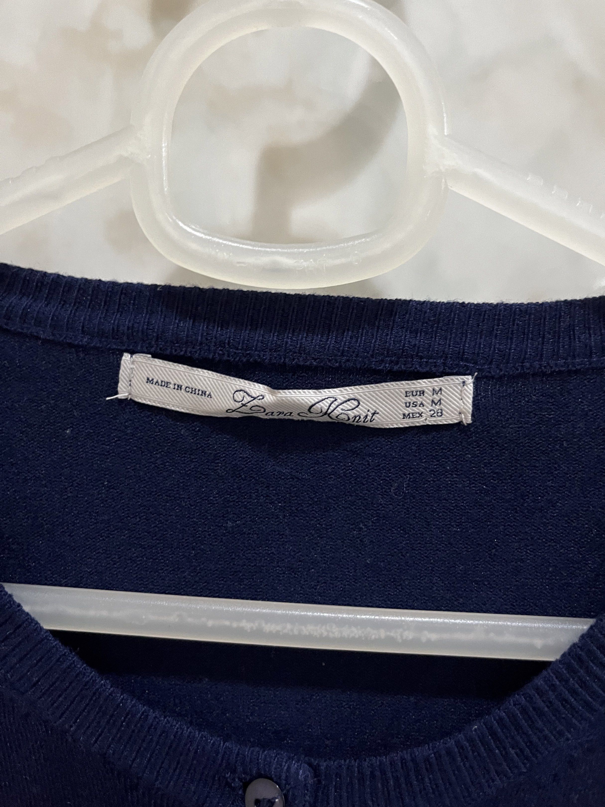 Zara Knit Navy Cardigan (Category: Coats, Jackets and Outerwear) located in Manila. Submitted by jcmph (Listing ID 1421007743, Image 3). Description: - Zara Knit navy blue cardigan - Size: M - Features: Round neck, button-down closure - Material: Viscose, Nylon, Elastane blend - Made in China Dimensions: Shoulders 14 inches Chest 16.5 inches Length 23 inches .