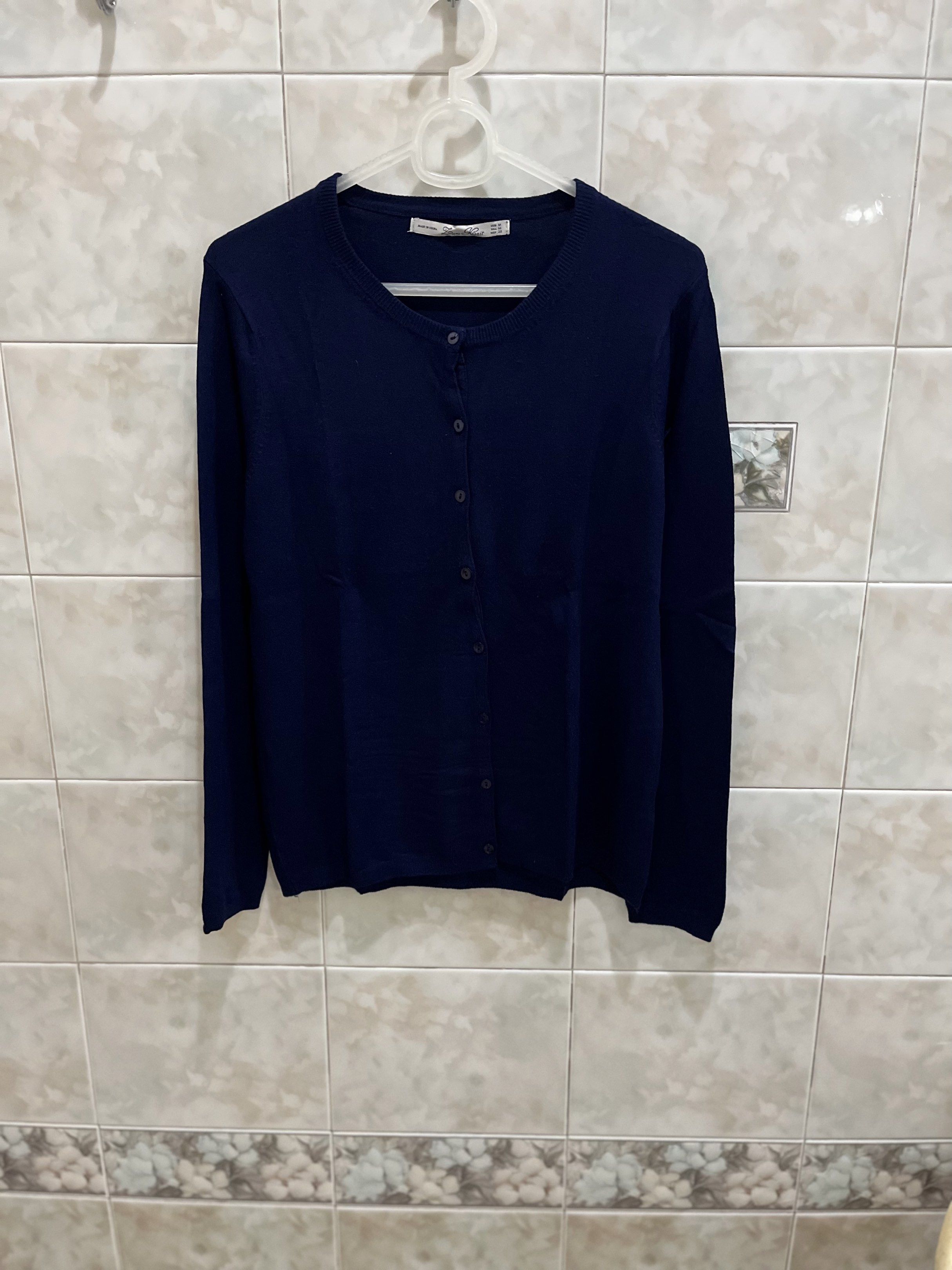 Zara Knit Navy Cardigan (Category: Coats, Jackets and Outerwear) located in Manila. Submitted by jcmph (Listing ID 1421007743, Image 1). Description: - Zara Knit navy blue cardigan - Size: M - Features: Round neck, button-down closure - Material: Viscose, Nylon, Elastane blend - Made in China Dimensions: Shoulders 14 inches Chest 16.5 inches Length 23 inches .