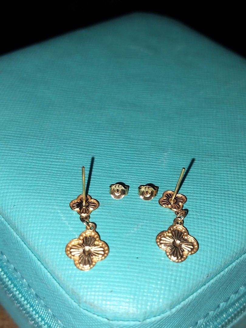 18k Gold Clover Earrings (Category: Earrings) located in Imus. Submitted by timelessfindph (Listing ID 1421232188, Image 2). Description: Elegant gold earrings featuring a clover design. The earrings have a post-back closure and come with additional earring backs. The design includes a smaller clover at the top and a larger, dangling clover below. The earrings appear to be made of a 18k gold. 0.7 grams 18k gold with 750 markings per piece only .