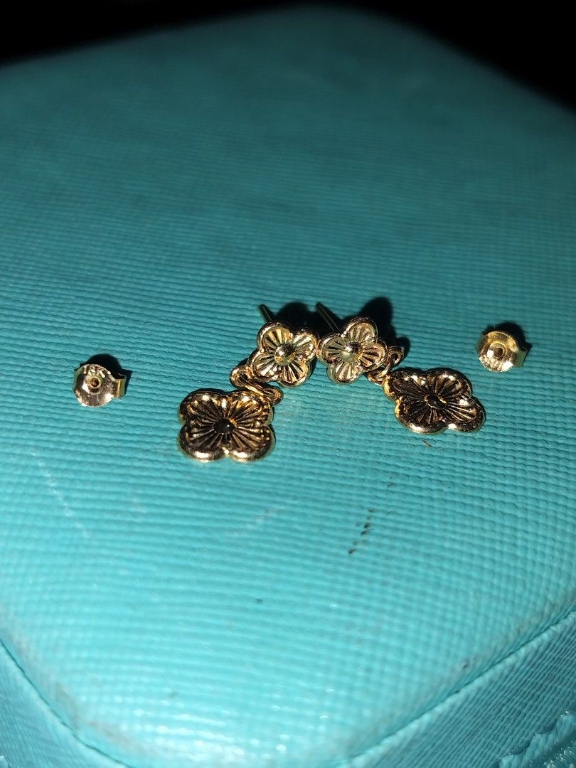 18k Gold Clover Earrings (Category: Earrings) located in Imus. Submitted by timelessfindph (Listing ID 1421232188, Image 3). Description: Elegant gold earrings featuring a clover design. The earrings have a post-back closure and come with additional earring backs. The design includes a smaller clover at the top and a larger, dangling clover below. The earrings appear to be made of a 18k gold. 0.7 grams 18k gold with 750 markings per piece only .