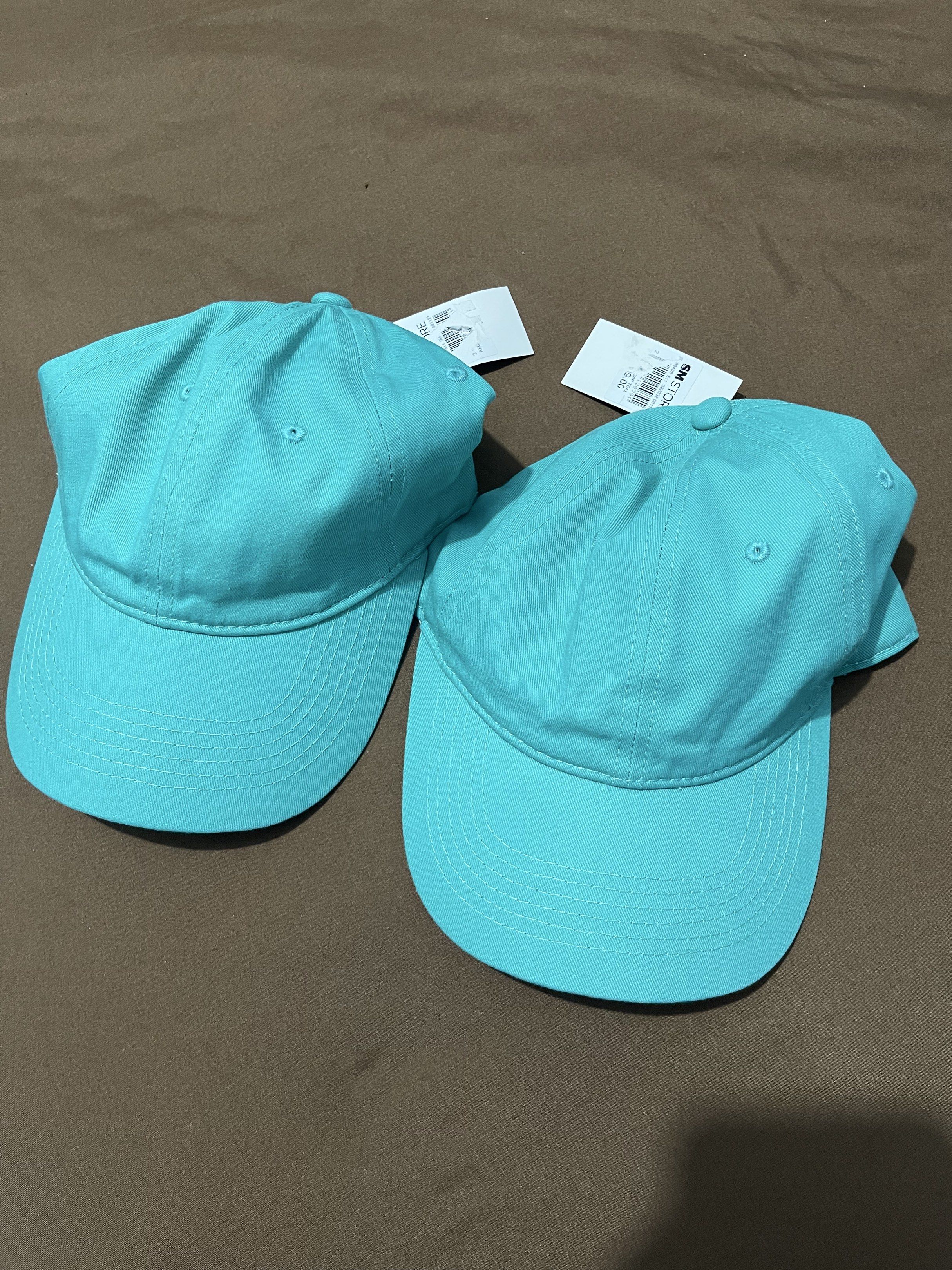 Brand New 2 pcs AXCS Cap (Category: Caps & Hats) located in Taguig. Submitted by cs4lt (Listing ID 1421246150, Image 2). Description: - Brand new OYCS teal baseball caps - Classic curved brim design - Adjustable strap for a perfect fit - Made from a comfortable, cotton-like material - Solid teal color - Comes with original tags.