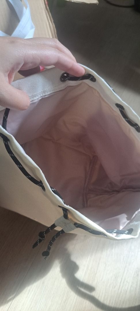 Adidas Drawstring Bag (Category: Backpacks) located in Manila. Submitted by rsamselleracc_fire (Listing ID 1421130267, Image 2). Description: - Adidas drawstring bag - White color - Black drawstring closure - Shoulder strap - Light pink interior - Adidas logo on front - Perfect for essentials.