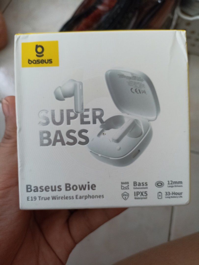 BASEUS TWS Earphones with Charging Case (Category: Earphones) located in Quezon City. Submitted by charlottes_boutique (Listing ID 1410404077, Image 3). Description: White TWS earphones with a charging case and USB-C charging cable. Includes extra ear tips for a customized fit. The earphones have a sleek, modern design. The charging case is compact and easy to carry. Perfect for listening to music or taking calls on the go..