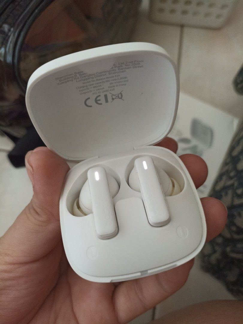 BASEUS TWS Earphones with Charging Case (Category: Earphones) located in Quezon City. Submitted by charlottes_boutique (Listing ID 1410404077, Image 2). Description: White TWS earphones with a charging case and USB-C charging cable. Includes extra ear tips for a customized fit. The earphones have a sleek, modern design. The charging case is compact and easy to carry. Perfect for listening to music or taking calls on the go..