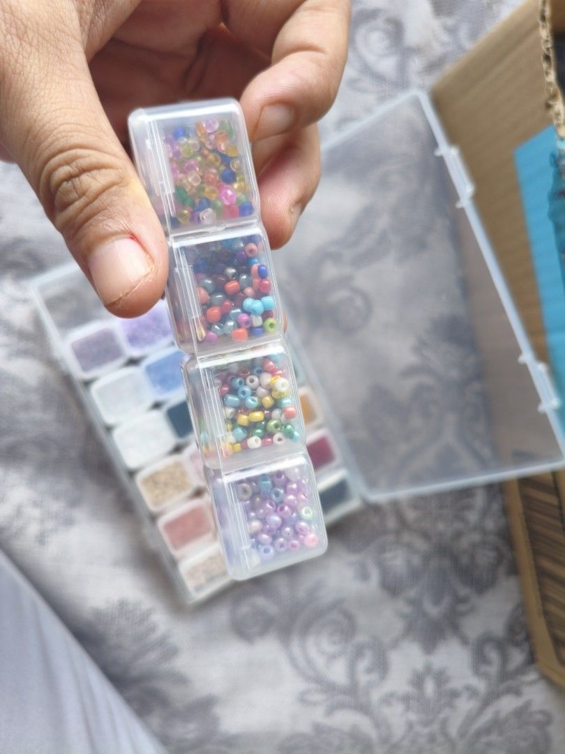 Beads in Organizer Box (Category: Craft Supplies & Tools) located in Arayat. Submitted by jpfinds19 (Listing ID 1421196384, Image 3). Description: - Assorted colorful beads - Clear organizer box with multiple compartments - Various bead colors and sizes - Perfect for crafting and jewelry making - Transparent box for easy bead selection.