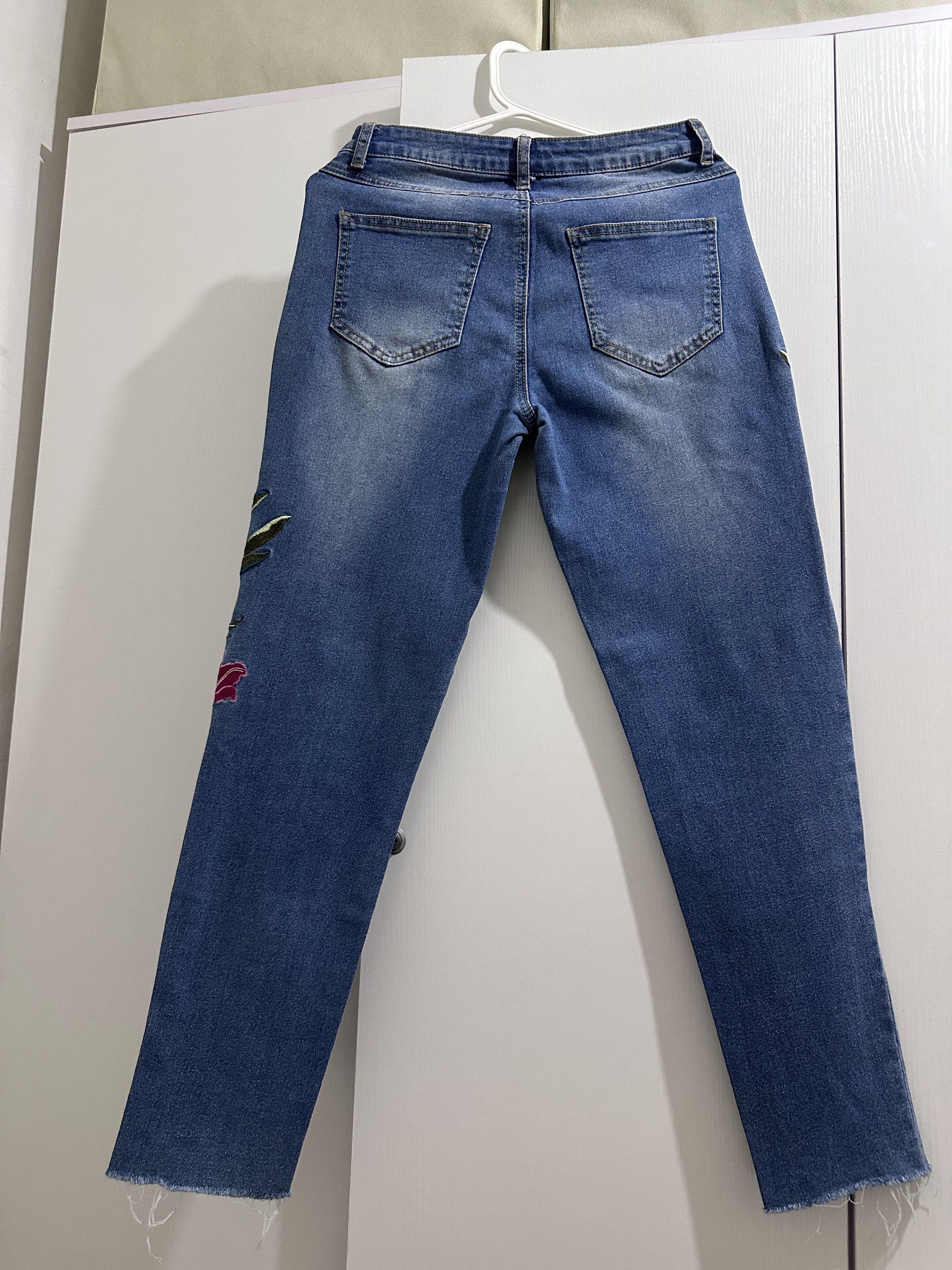 Bench Mid Waist Floral Embroidered Jeans (Category: Jeans) located in Taguig. Submitted by adanzaj (Listing ID 1420004723, Image 2). Description: - Bench jeans - Floral embroidery - Size 26 - Stretchable - Straight leg fit - Classic blue wash - Button and zipper closure - Raw hem detail.