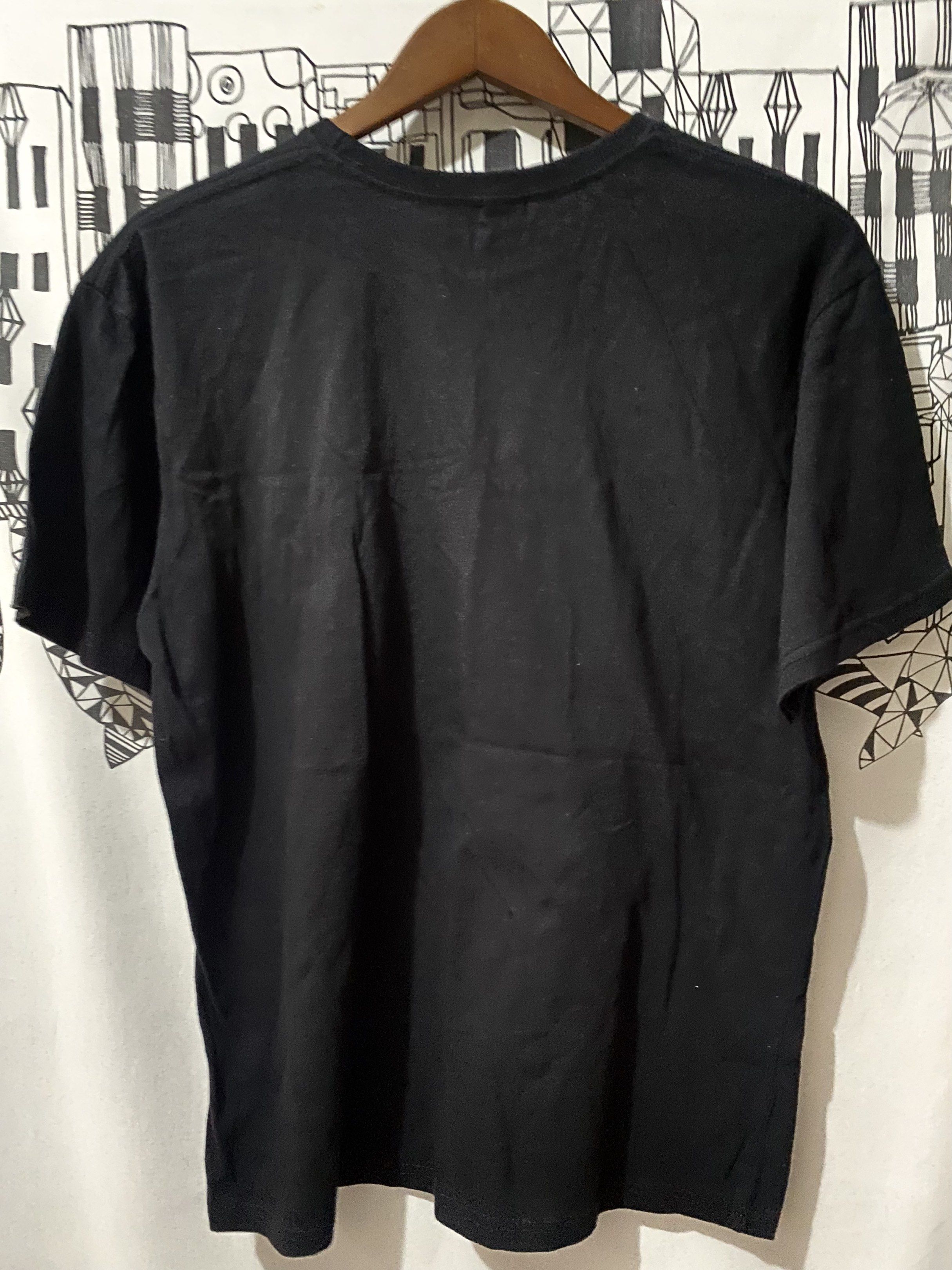 Black Doha Qatar Graphic T-shirt (Category: Tshirts & Polo Shirts ) located in Quezon City. Submitted by hirono18 (Listing ID 1421214006, Image 3). Description: - BLACK graphic t-shirt - Design includes a sailboat, camel, and stars - Crew neck style - Plain black back - Cotton soft.