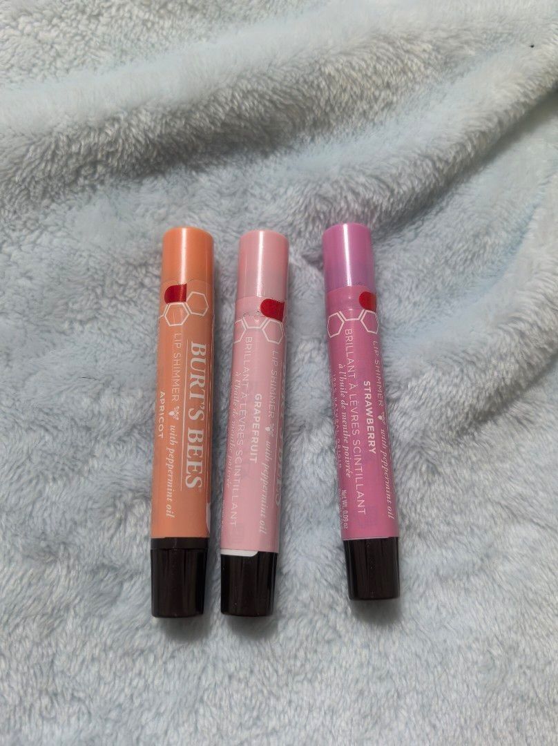 Burt's Bees Shimmer Lip Balm (Category: Makeup) located in Quezon City. Submitted by rhai_decluttering (Listing ID 1417125226, Image 1). Description: - Burt's Bees Lip Balm - Includes three tubes: Apricot Grapefruit Strawberry - SOLD 500 each take all for 900.