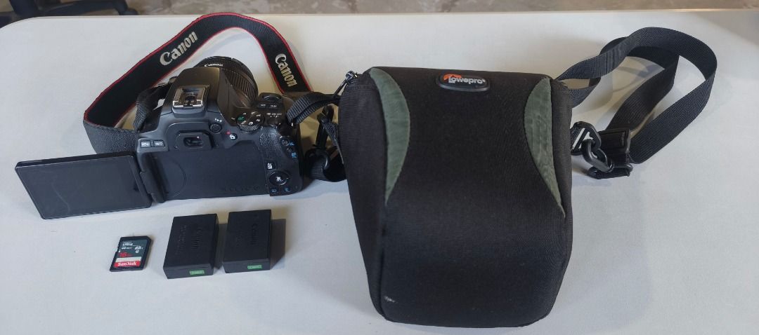 Canon EOS 200D II with Lens and Accessories (Category: Cameras) located in Caloocan City. Submitted by cleocarakm55983 (Listing ID 1421144178, Image 1). Description: - Canon EOS 200D II camera with 18-55mm lens - Includes two batteries - Comes with a memory card - Includes a Lowepro camera bag - Camera strap included - Perfect for photography enthusiasts!.