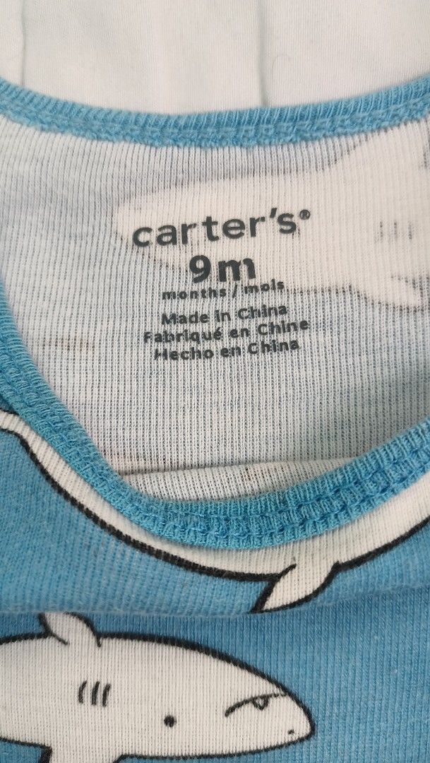 Carter's Shark Print Onesie 9M (Category: Babies & Kids Fashion) located in Quezon City. Submitted by _itsmemarie_ (Listing ID 1421190512, Image 2). Description: - Carter's onesie - Fun shark print - For babies aged 9 months - 100% cotton - Blue base color - White shark illustrations - Made in China.