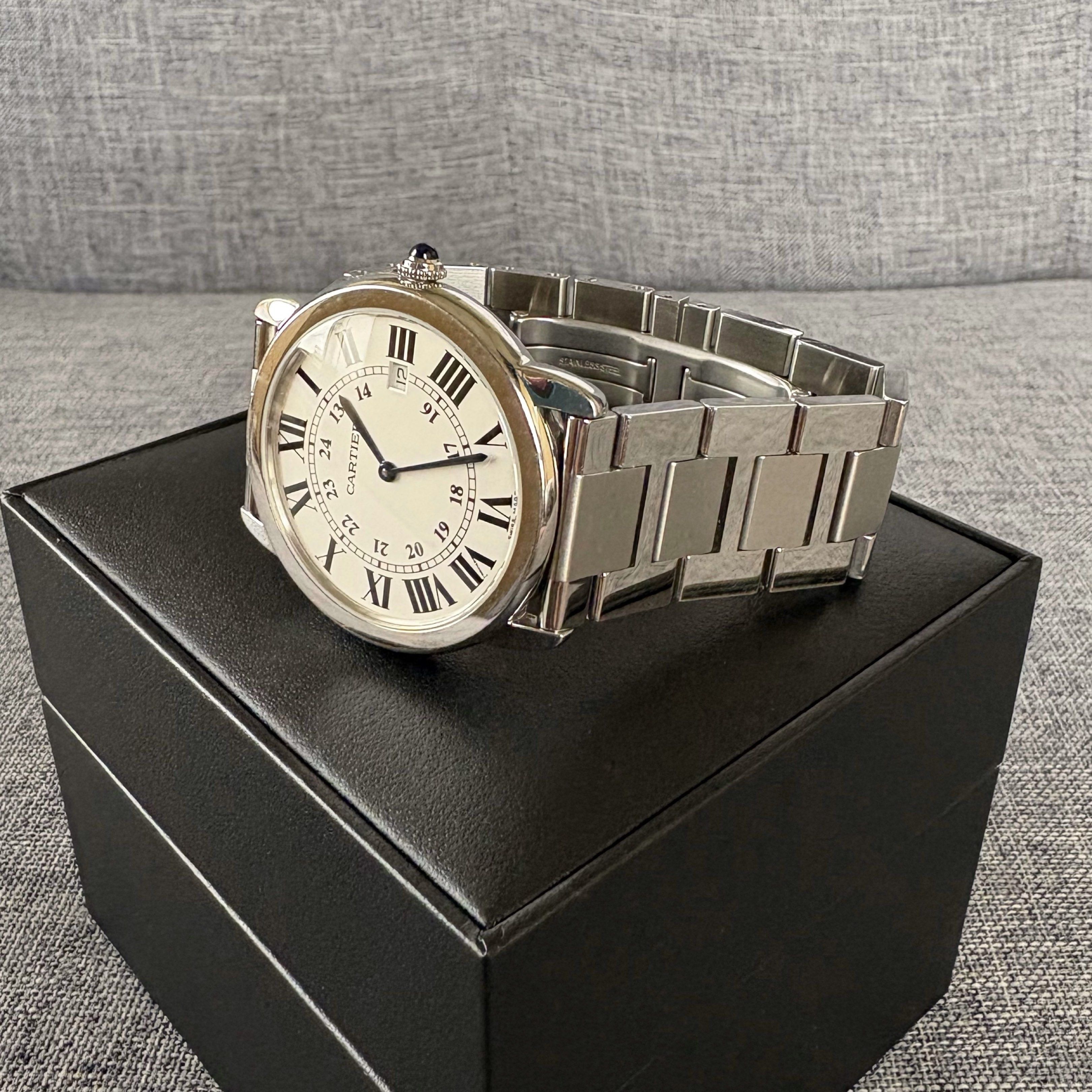 Cartier Ronde Solo LM (Category: Luxury Watches) located in Taguig. Submitted by future.fits (Listing ID 1421254241, Image 3). Description: • 36mm stainless steel • Quartz movement • Part of the Ronde Solo line (mid-2000s to late-2010s) • Silvered opaline dial with Roman numerals + Sapphire cabochon crown • Date display at 3:00 • Comes with box and authenticity papers.