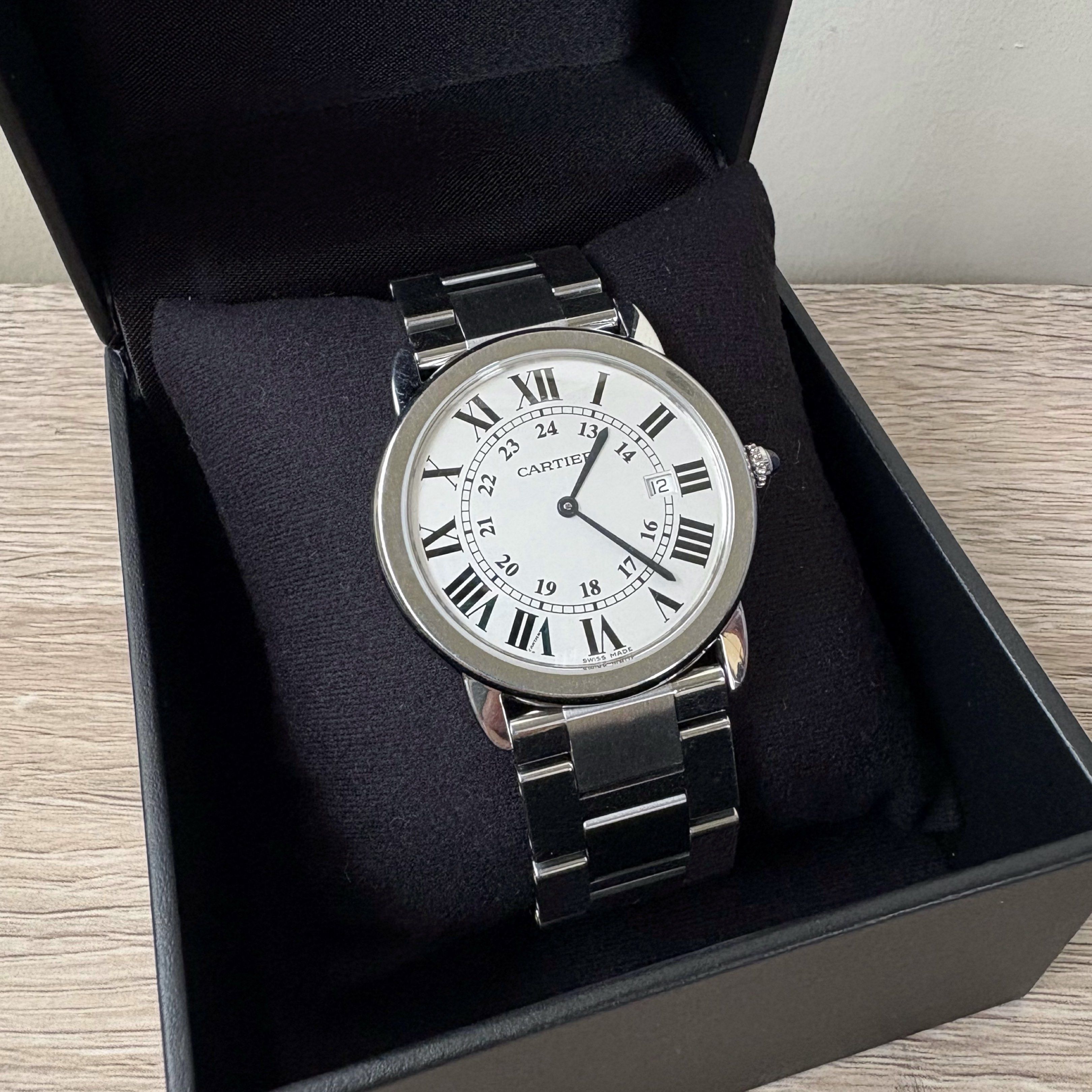Cartier Ronde Solo LM (Category: Luxury Watches) located in Taguig. Submitted by future.fits (Listing ID 1421254241, Image 1). Description: • 36mm stainless steel • Quartz movement • Part of the Ronde Solo line (mid-2000s to late-2010s) • Silvered opaline dial with Roman numerals + Sapphire cabochon crown • Date display at 3:00 • Comes with box and authenticity papers.