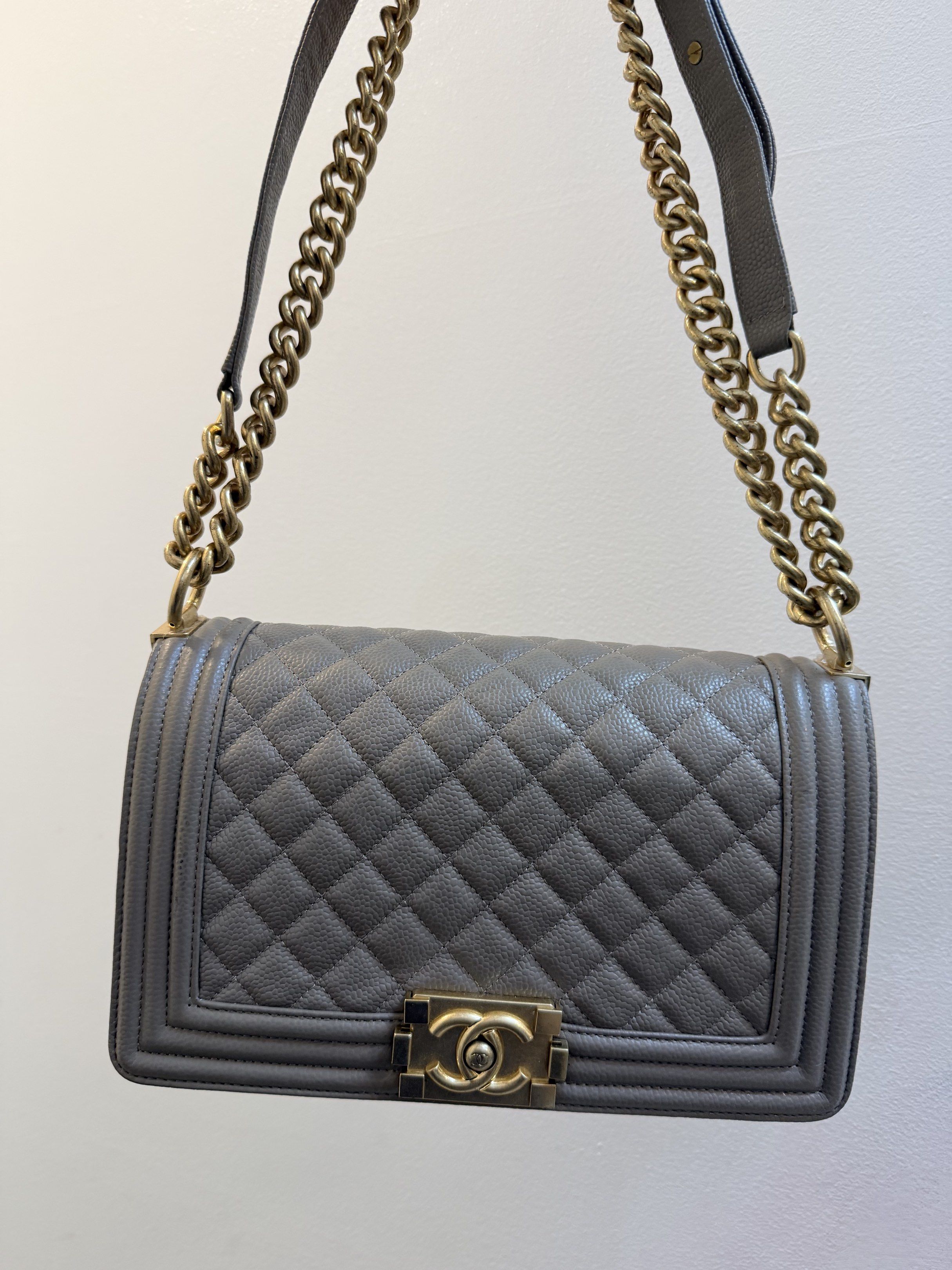 Chanel Boy Bag from Thrift shop (Category: Luxury Bags & Wallets) located in Manila. Submitted by denkim (Listing ID 1421162423, Image 1). Description: - Chanel Boy Bag - Quilted design - Gold-tone chain strap - Signature CC clasp - Rectangular shape - Neutral exterior color NGA - Fabric lining - Interior pocket - Minor wear on hardware.